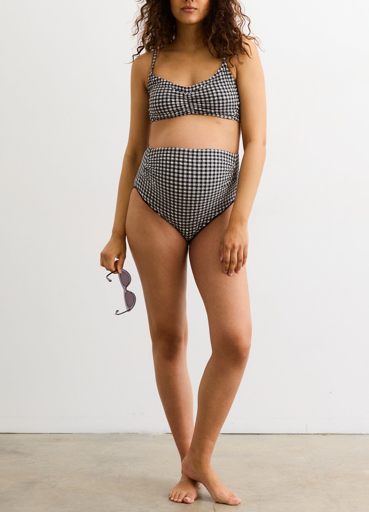 The Zanzibar Bikini - Black and white gingham maternity bikini with adjustable straps designed for nursing and postpartum comfort.