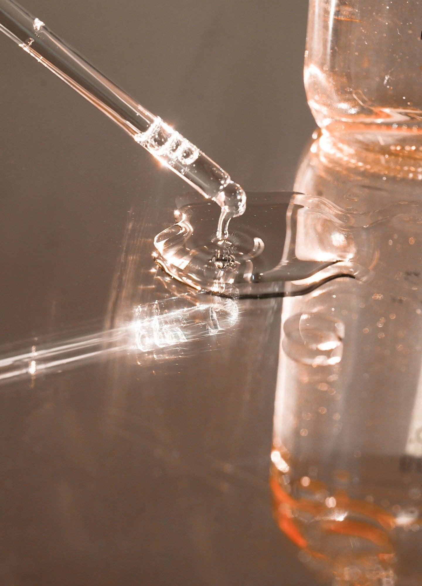 Belly Oil (Copy) - Clear glass bottle of maternity belly oil with soft pink liquid, designed for pregnancy, nursing, and postpartum care next.