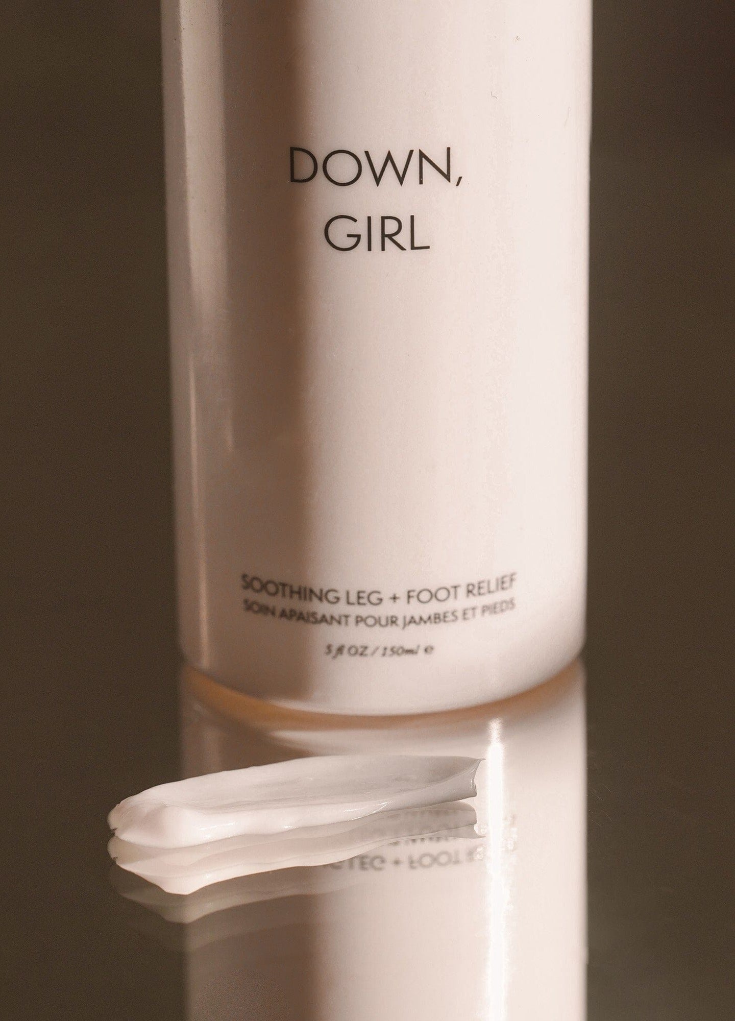 Down, Girl - White lotion bottle labeled Down, Girl with smooth cream dollop, designed for maternity, pregnancy, nursing, postpartum care.