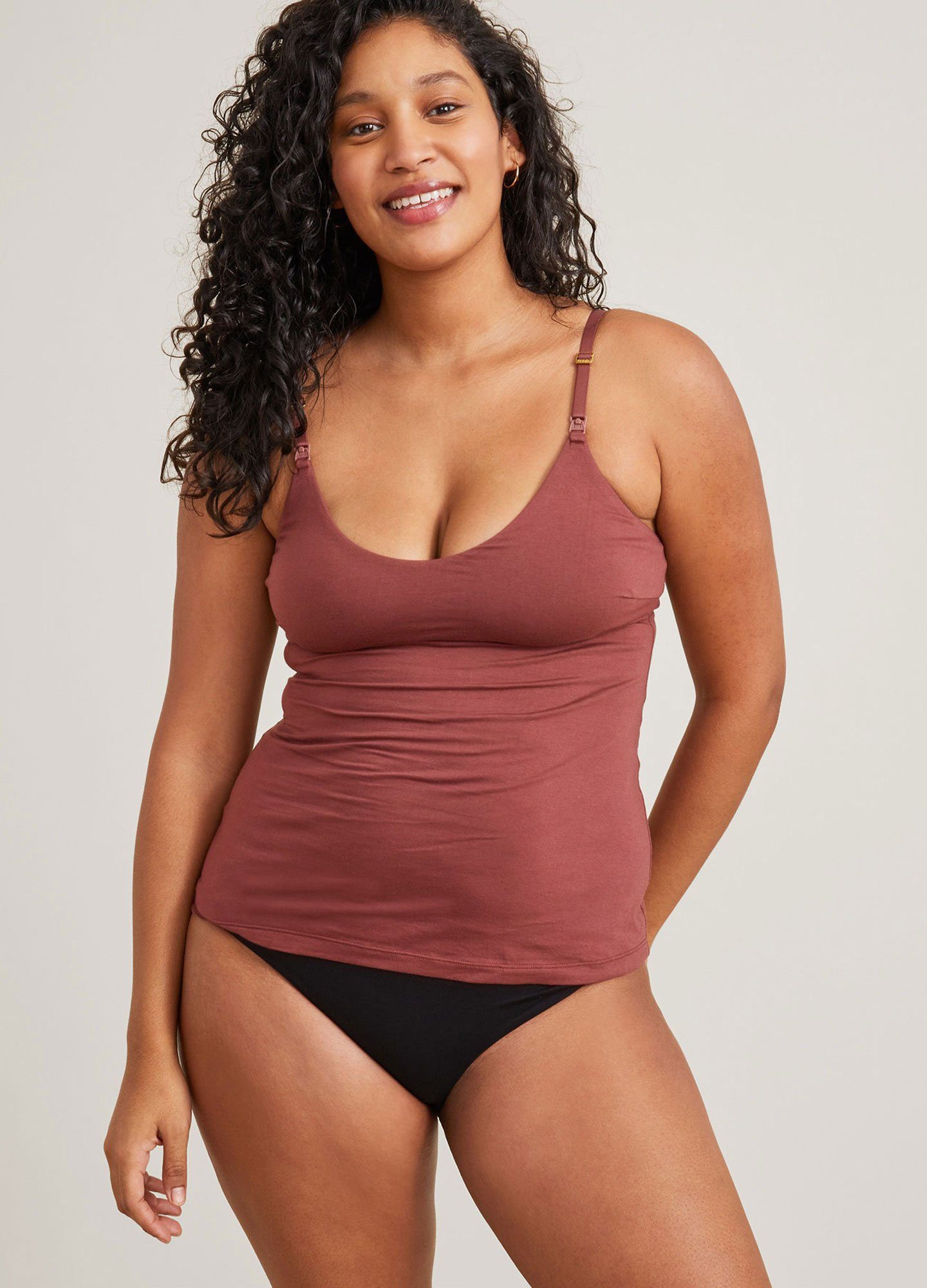 The 24/7 Nursing Tank - Anise-colored maternity nursing tank with adjustable straps and V-neck, designed for pregnancy and postpartum comfort.