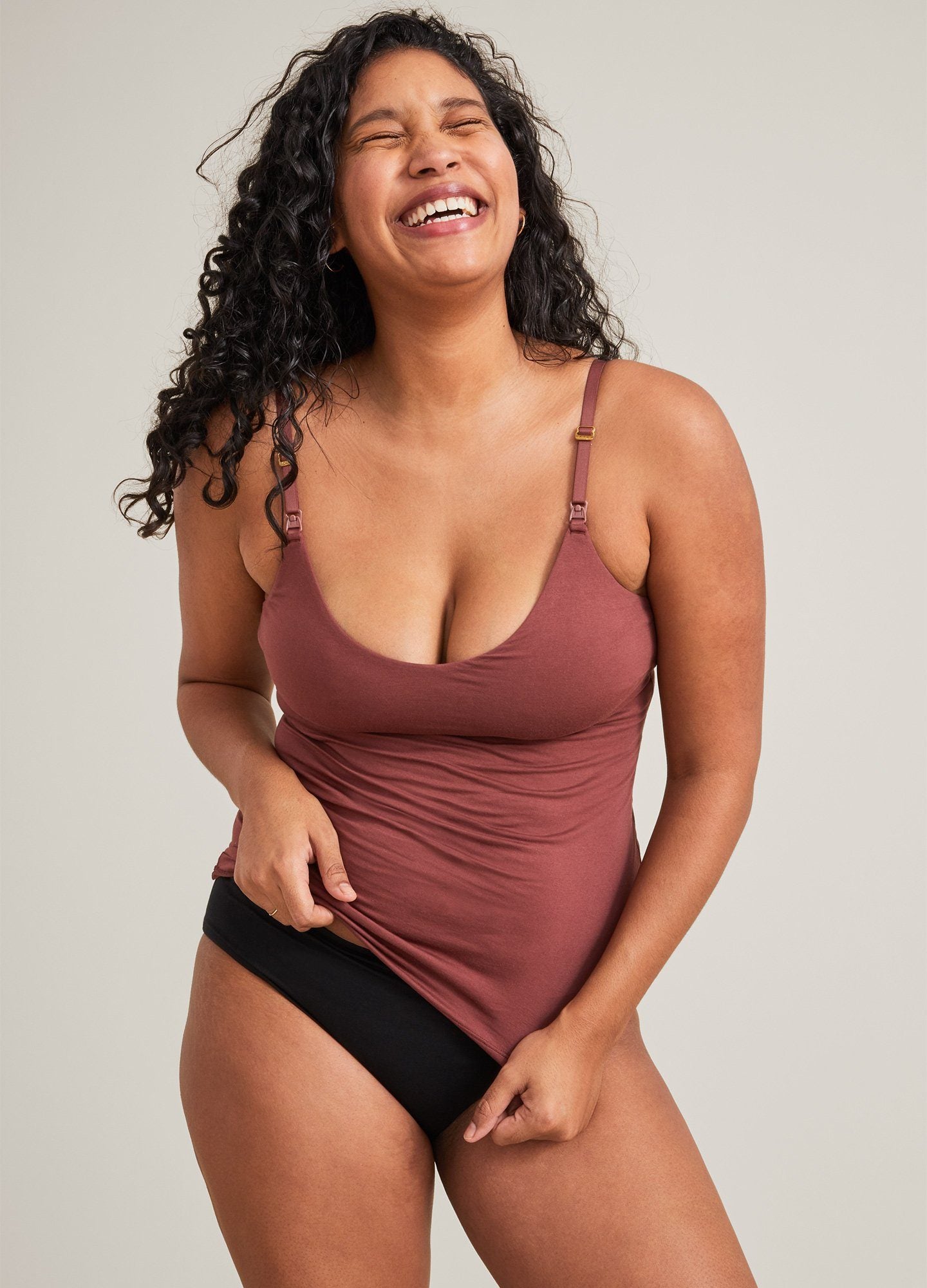 The 24/7 Nursing Tank POS - Buff-colored nursing tank with scoop neckline and slim straps, designed for maternity and postpartum wear.