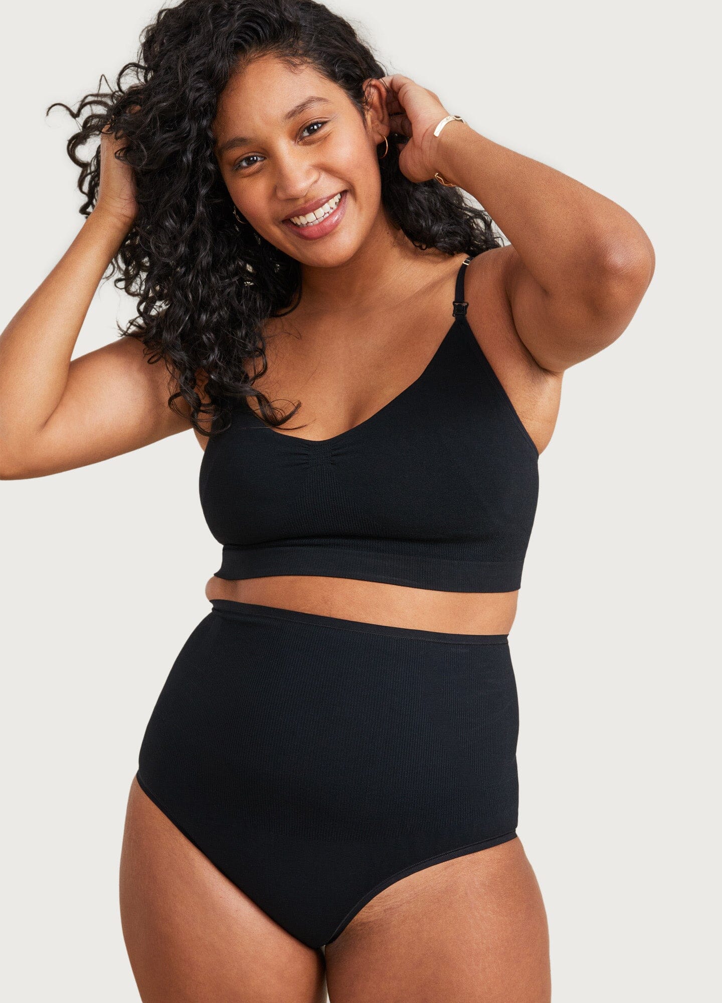 The Essential Nursing And Pumping Bra - Black maternity nursing bra with adjustable straps, soft seamless fabric for pregnancy and postpartum comfort.