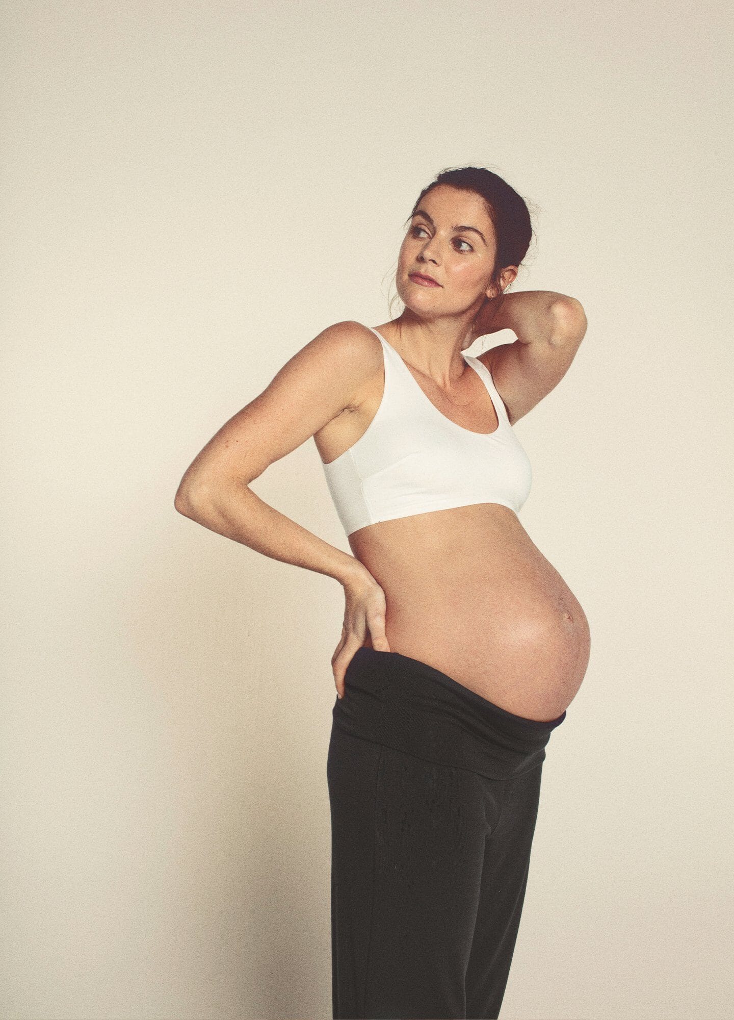 Seamless white maternity bra with wide straps and full coverage designed for comfort and support.