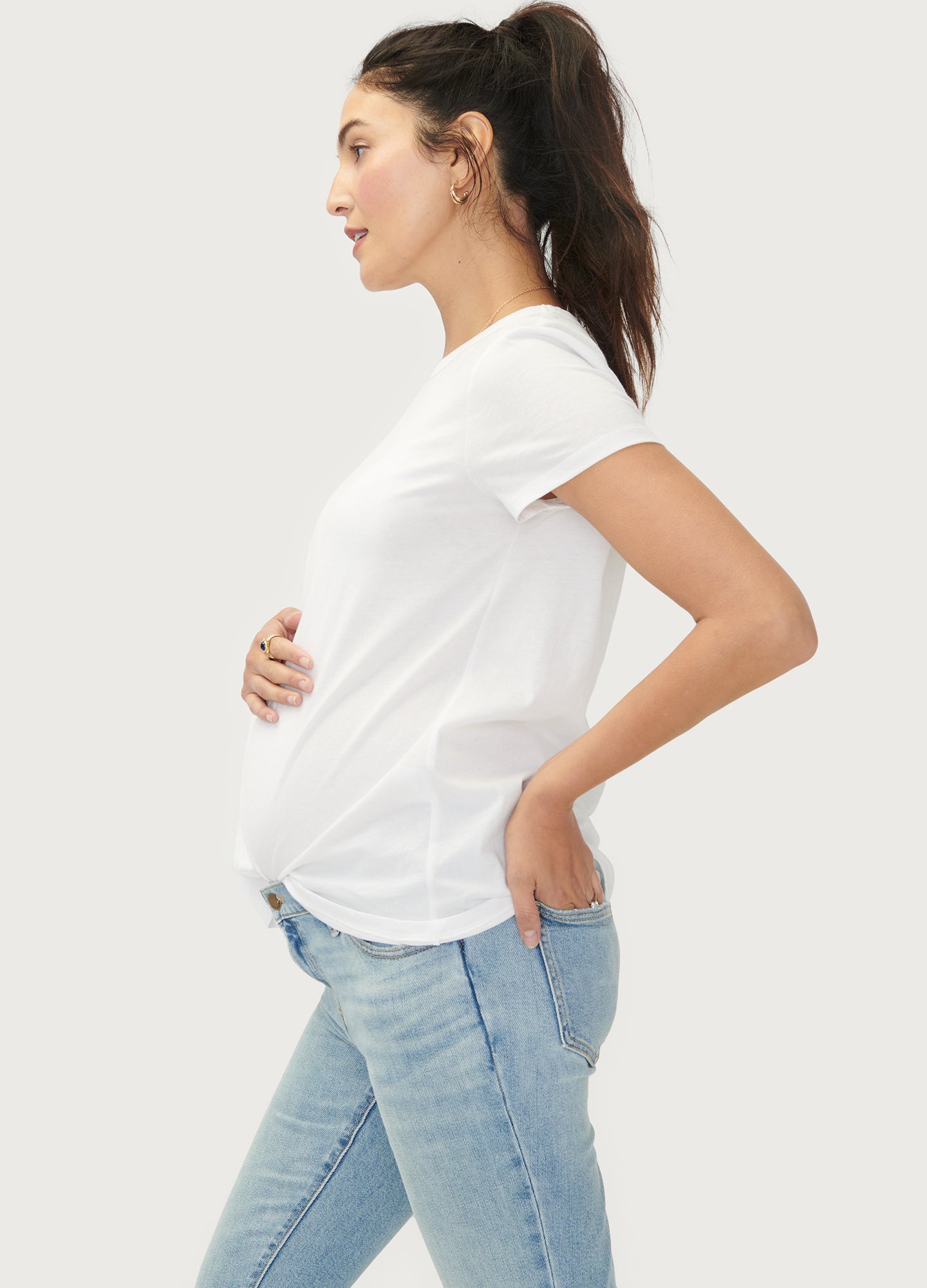 The Basic Crew Tee 2-Pack - Black maternity nursing crew tee with short sleeves and curved hem, modeled with light blue jeans.