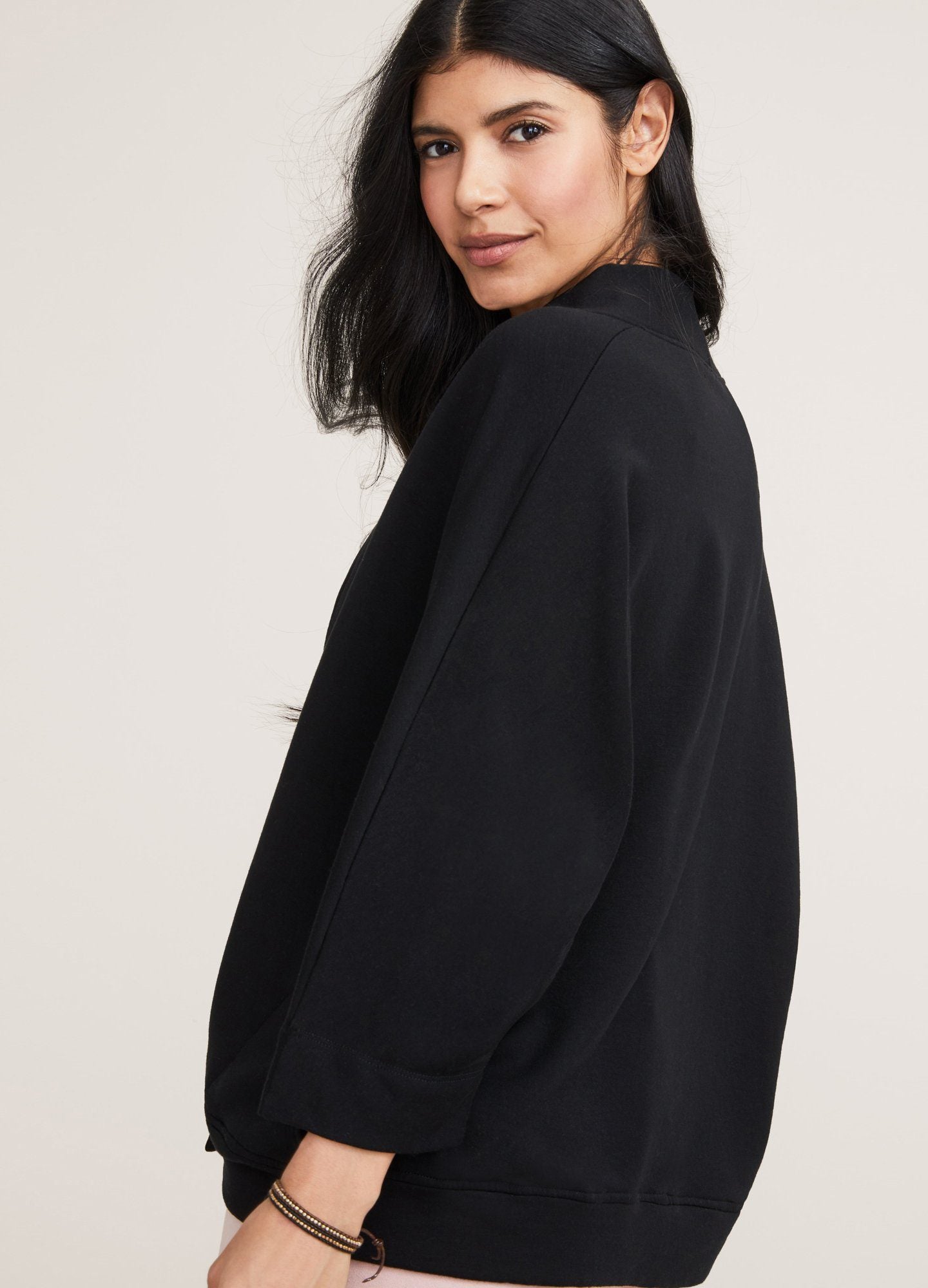 The Early Days Nursing Sweatshirt - Black maternity nursing sweatshirt with crossover front and relaxed fit, styled for postpartum comfort.