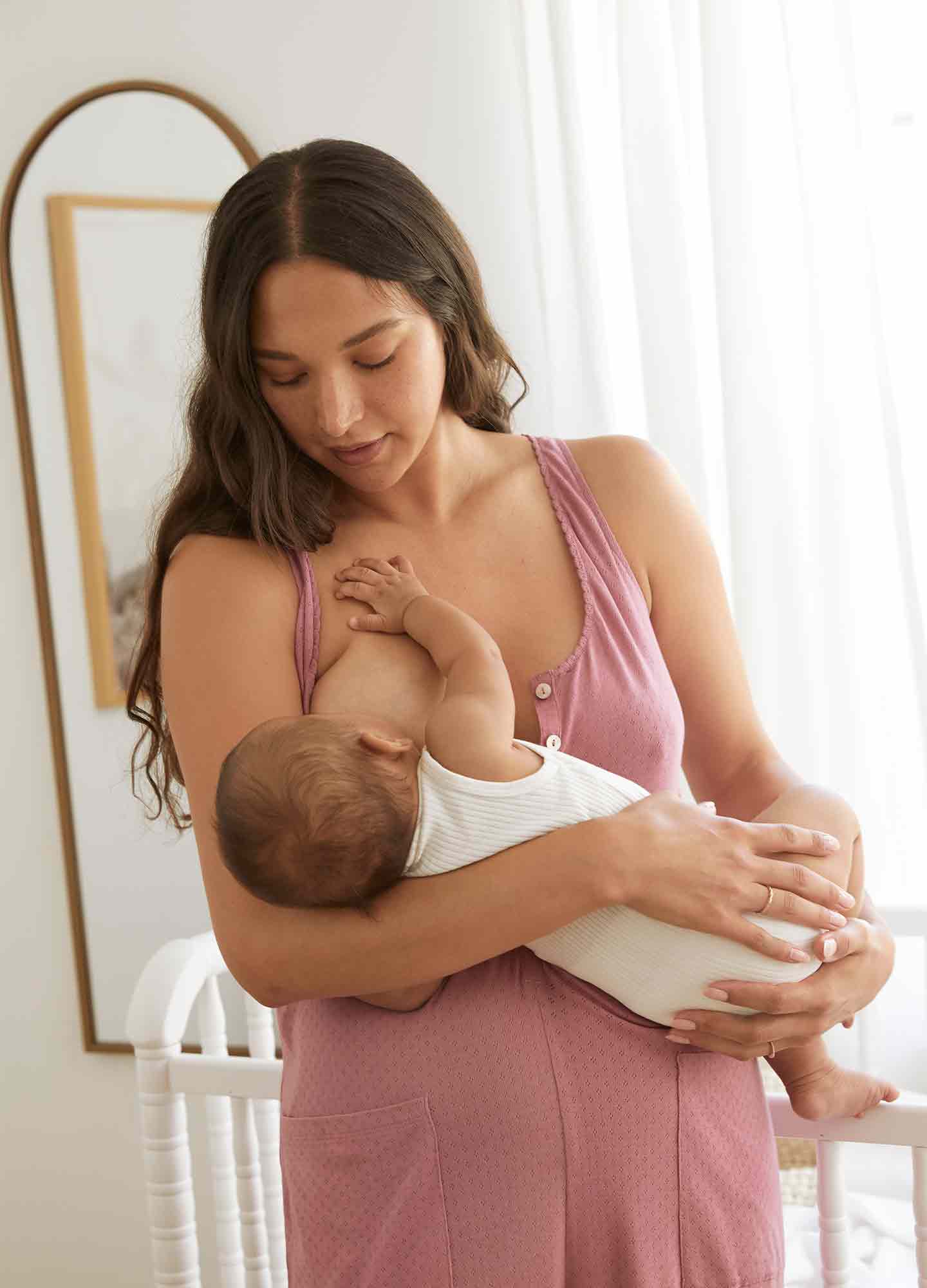 The 24/7 Feeding Jumpsuit POS - Lilac maternity jumpsuit with sleeveless V-neck, nursing-friendly front buttons, and wide-leg fit for postpartum comfort.