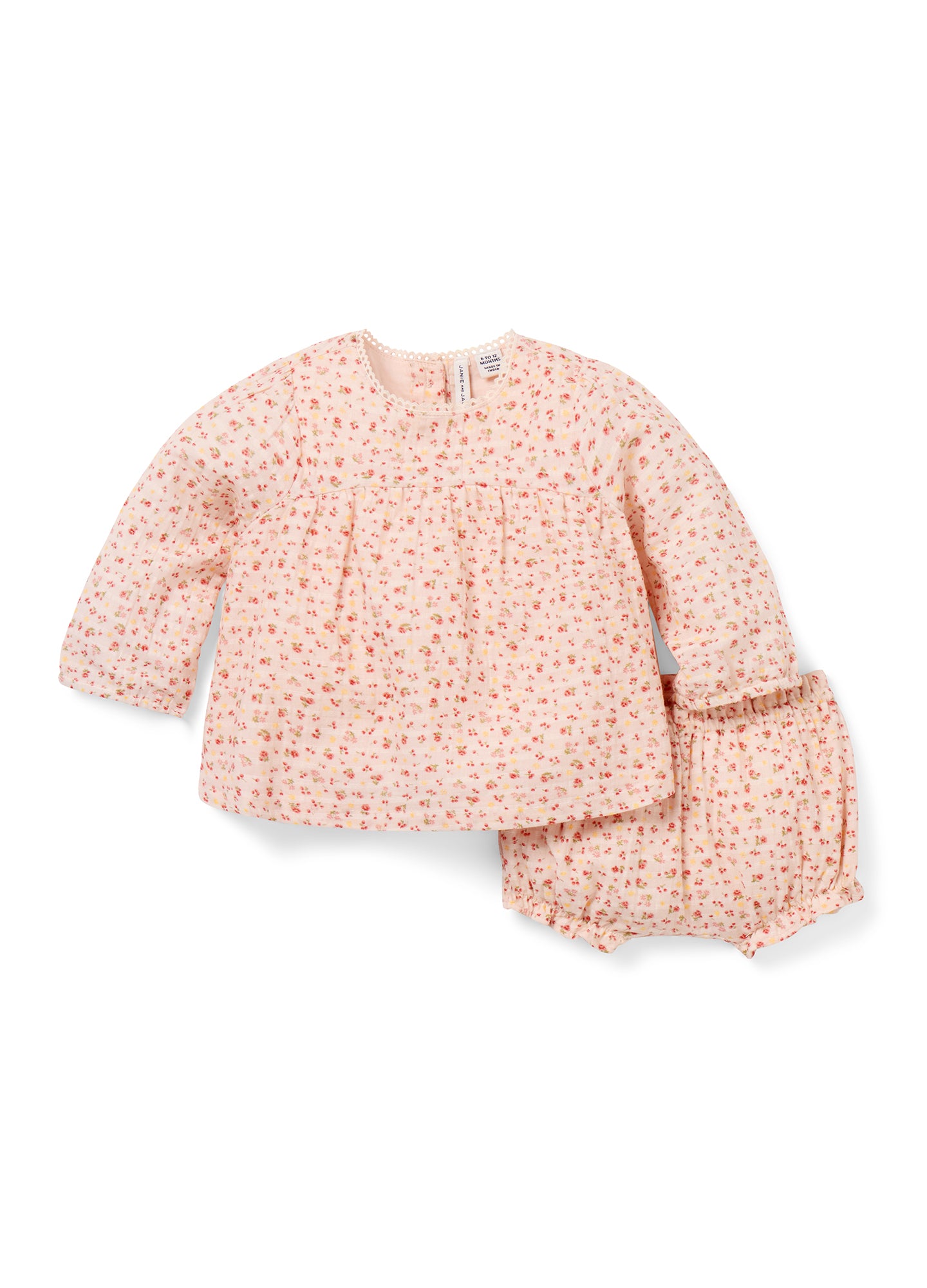 Light pink floral long-sleeve baby top with matching bloomer shorts in soft cotton.