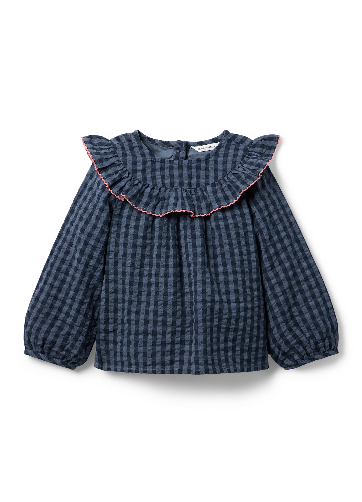 Navy blue gingham maternity top with long puff sleeves and ruffled collar edged in red piping.
