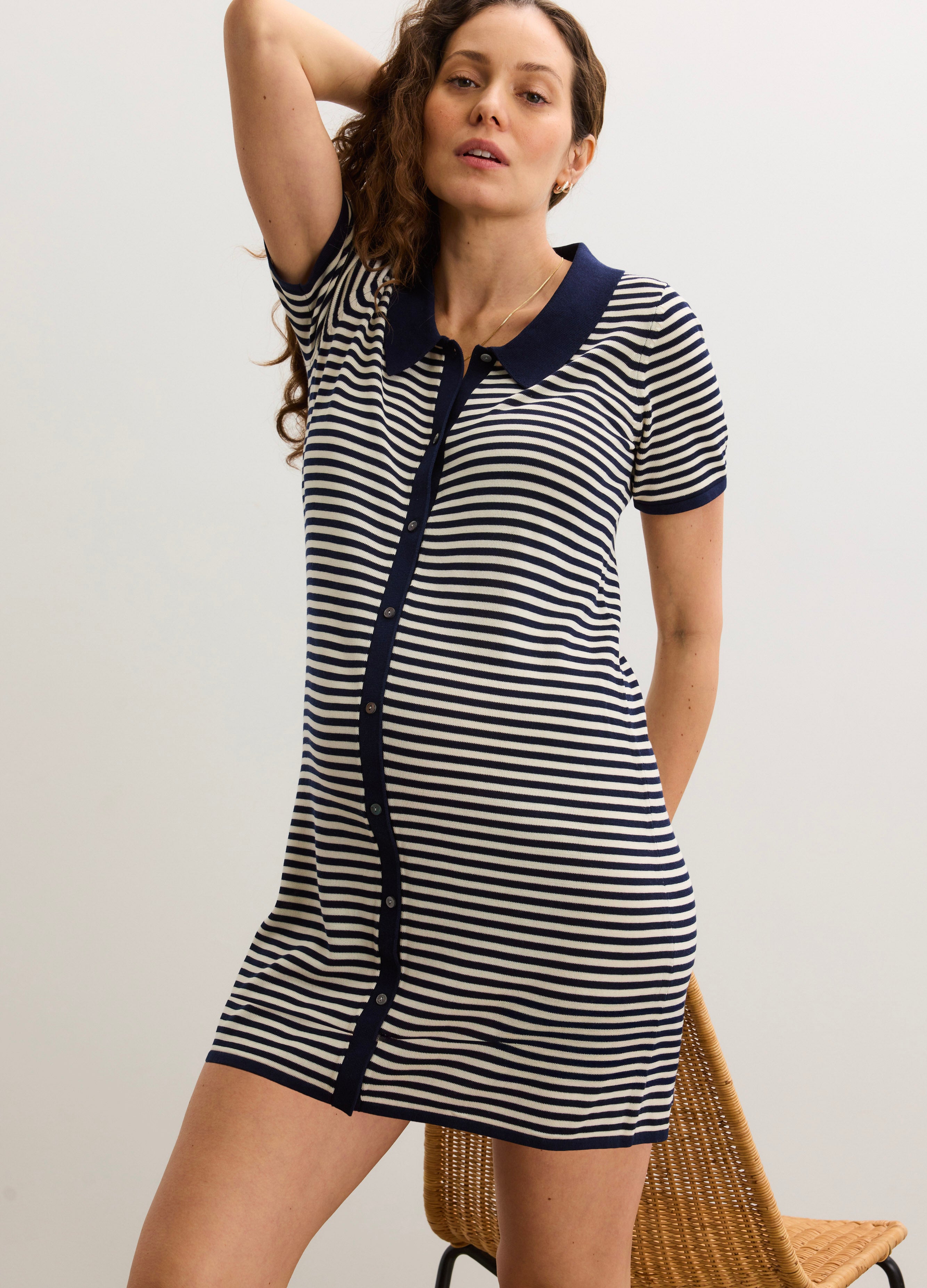 Navy and white striped short-sleeve maternity dress with button front and polo collar.