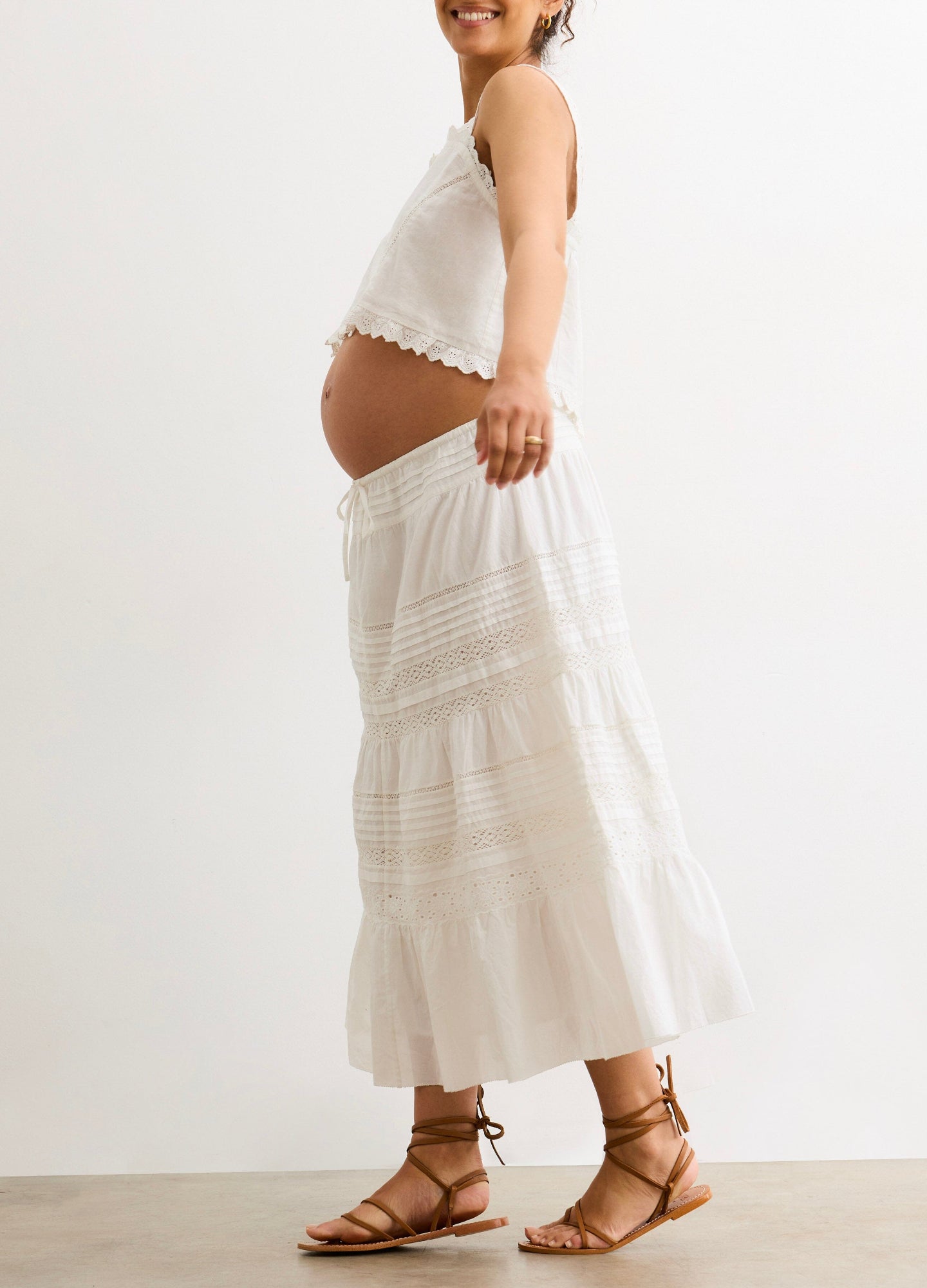 The Ada Skirt - White flowy maternity skirt with tiered lace details, designed for pregnancy, nursing, and postpartum comfort.