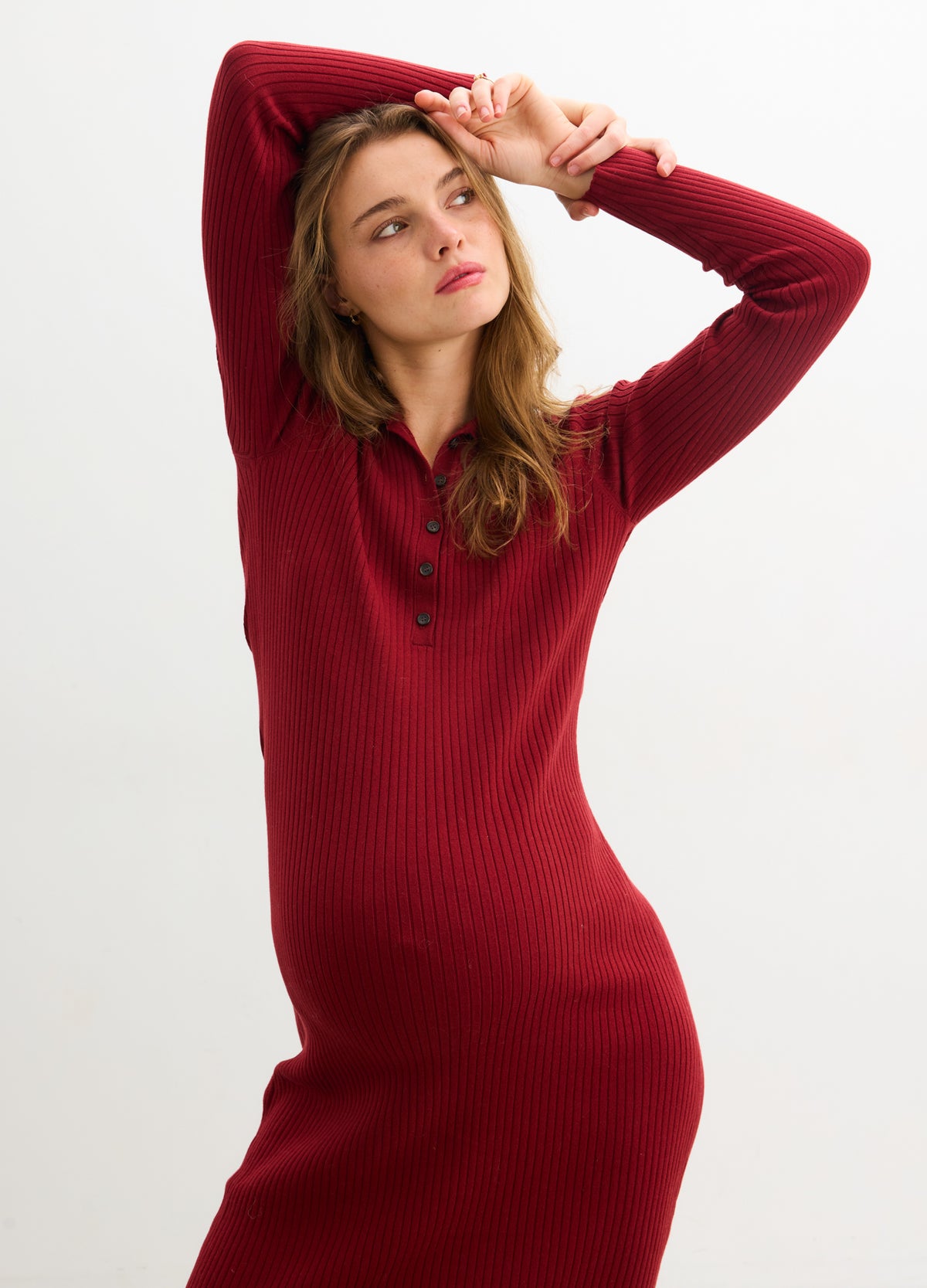 Averie Polo Rib Sweater Dress - Cranberry ribbed maternity sweater dress with long sleeves and a polo collar, styled for pregnancy and nursing.