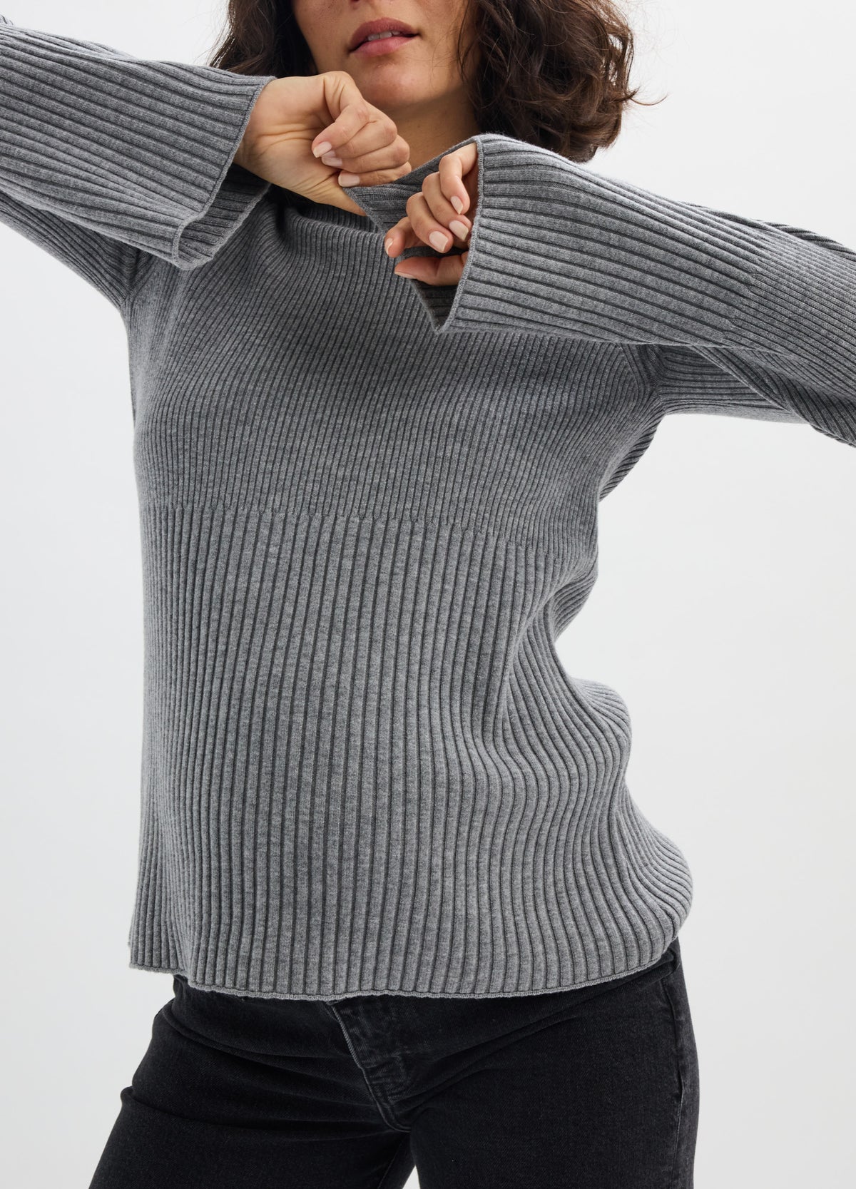 Gray ribbed knit turtleneck sweater with long sleeves, styled for maternity fit.