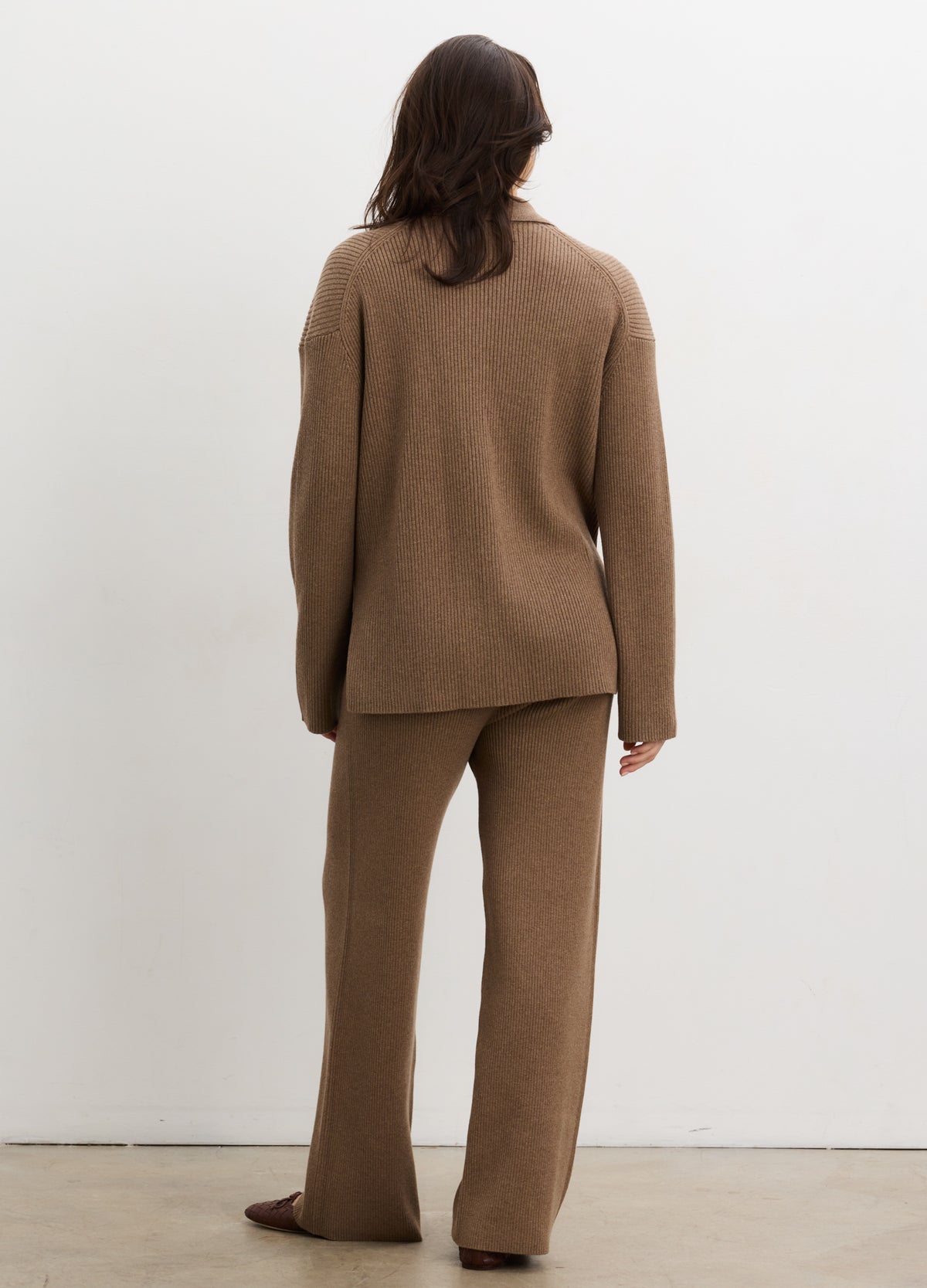Brown ribbed knit maternity pants with a relaxed straight-leg fit and soft stretchy fabric.