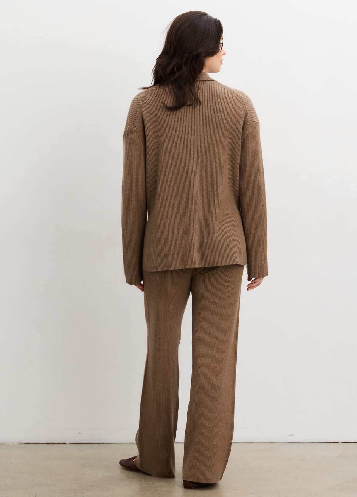 Brown ribbed knit long-sleeve buttondown polo paired with matching loose pants, suited for maternity wear.
