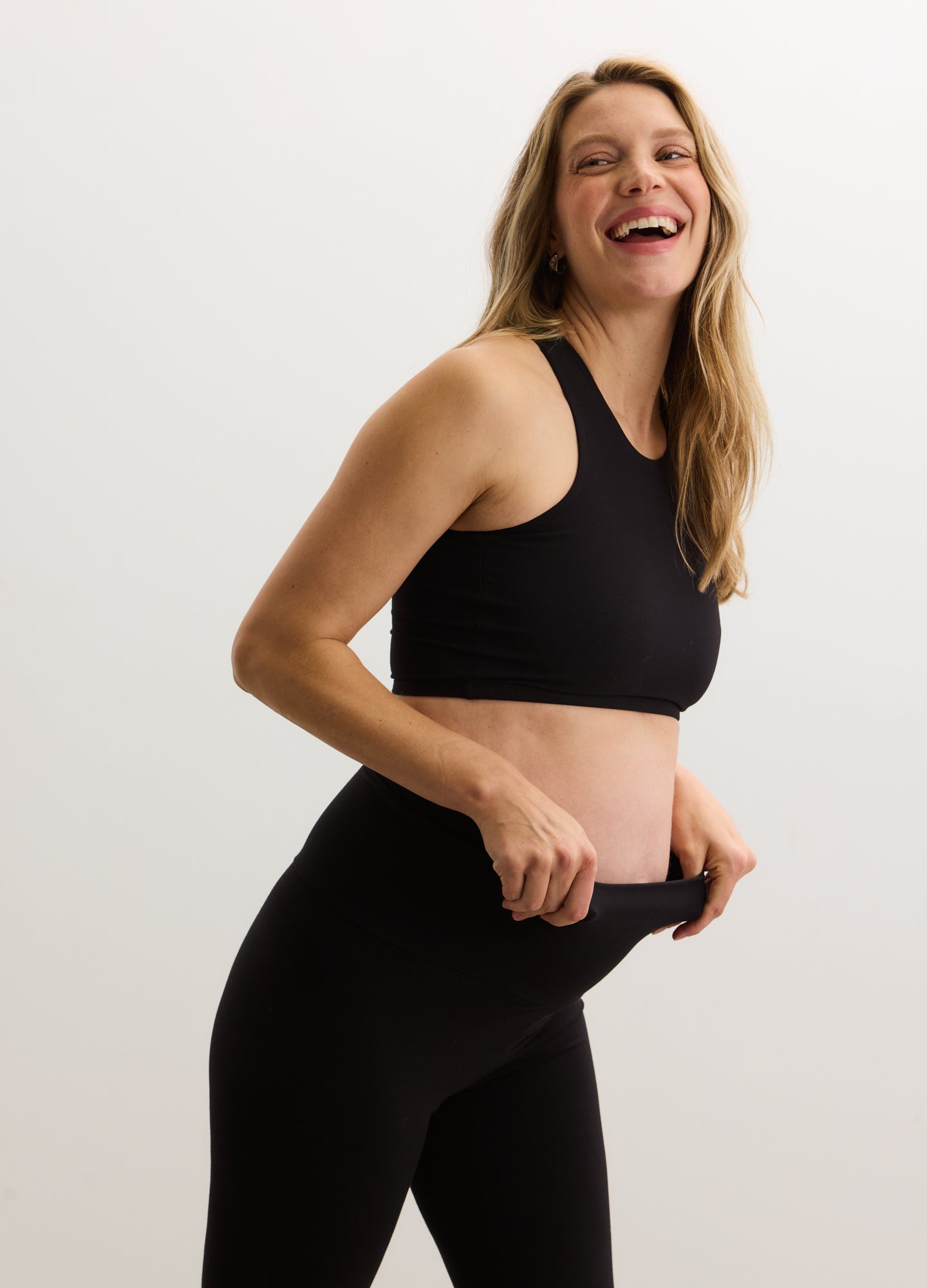 Black high-waist maternity capri leggings with stretchy fabric and a supportive belly panel.