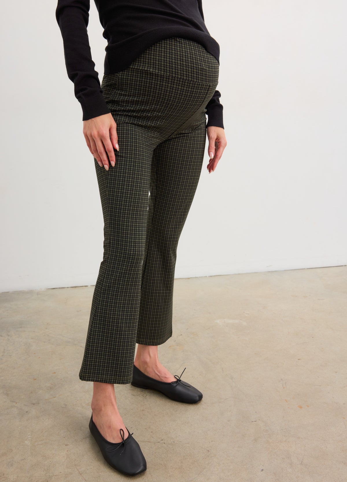 Olive green ribbed maternity crop flare leggings with stretchy waistband for pregnancy support.