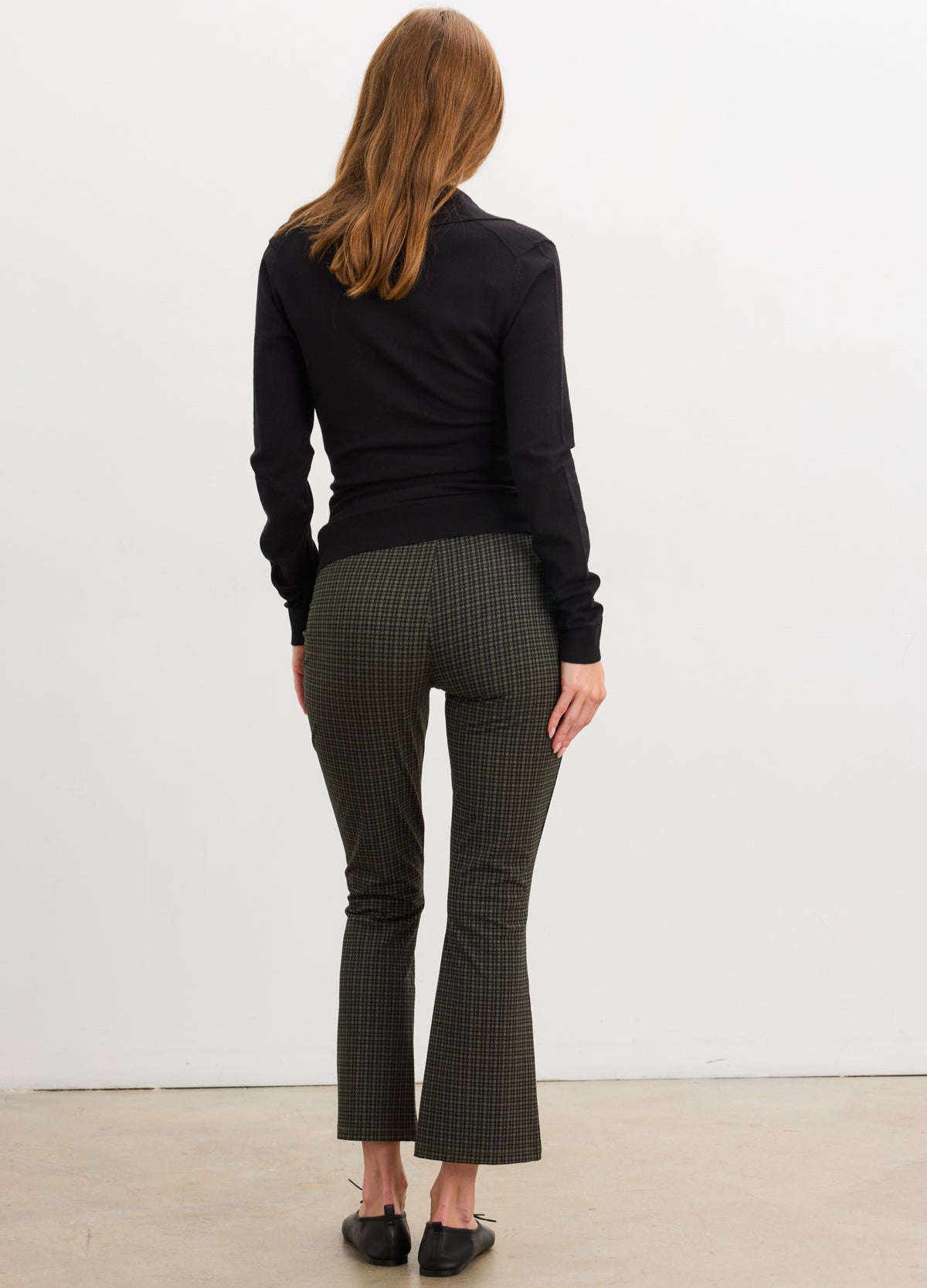 Olive green maternity crop flare leggings with a smooth, stretchy fabric and fitted silhouette.