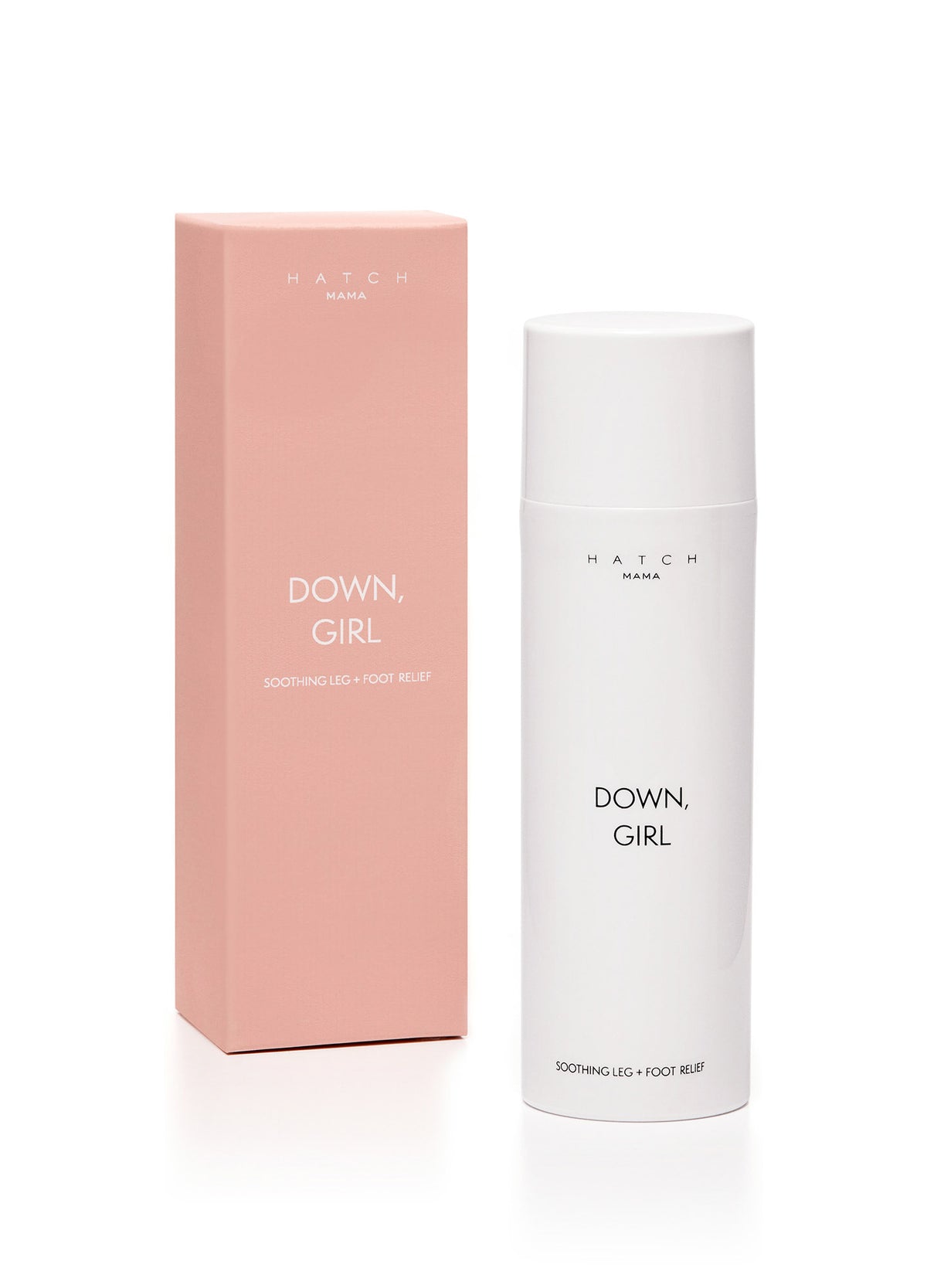 White cylindrical bottle with minimal black text beside tall rectangular pink box labeled Down Girl and maternity essentials.