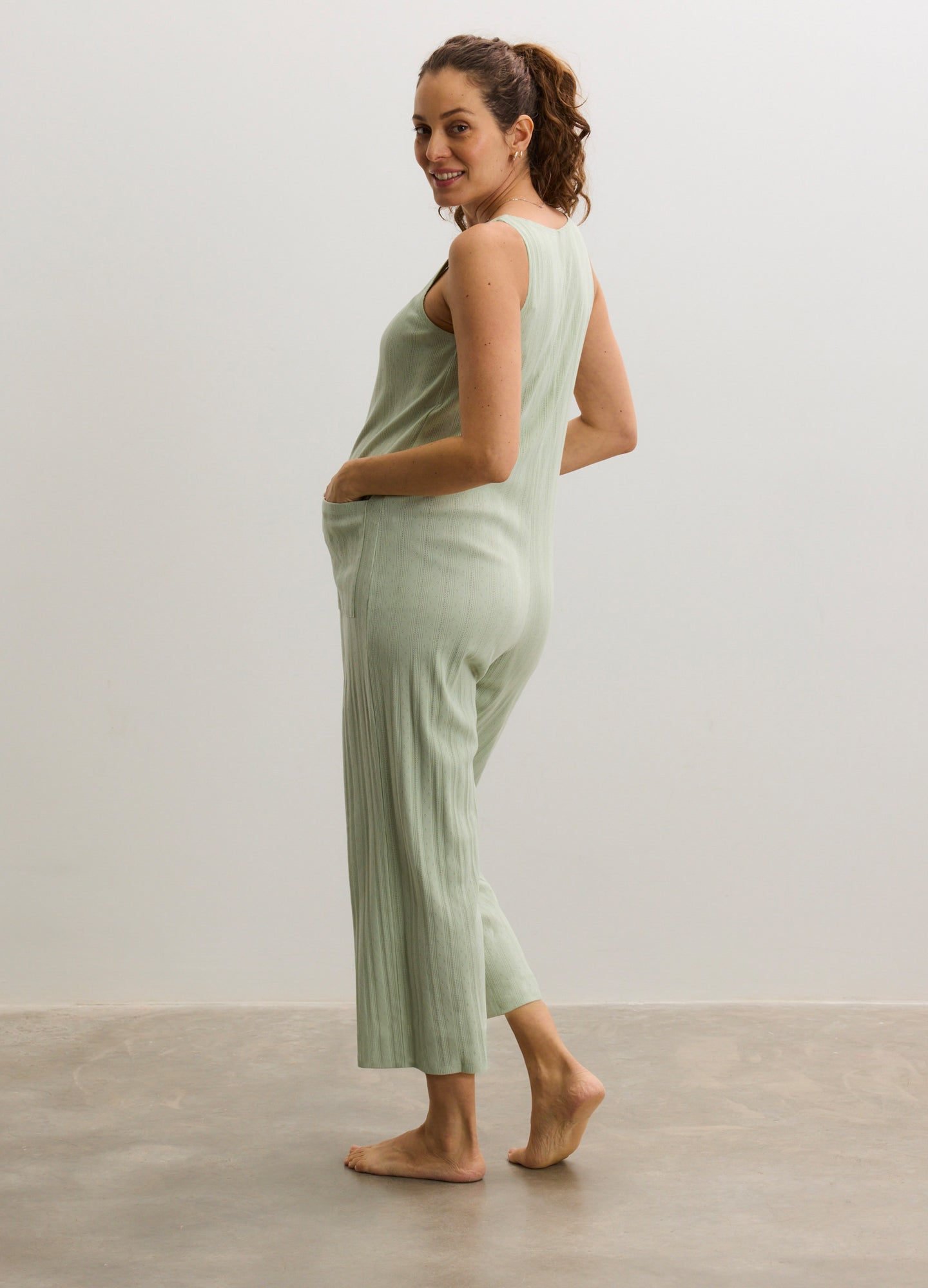 Soft sage green ribbed maternity lounge set with sleeveless tank and cropped pants.