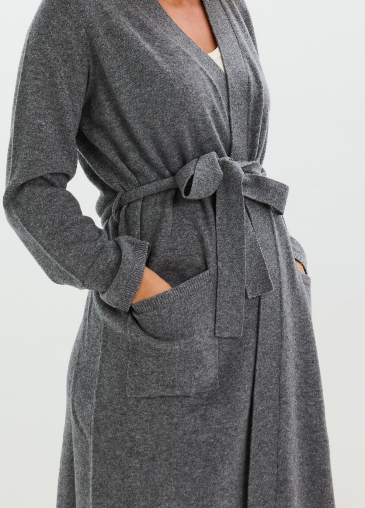 Charcoal gray cashmere robe with a shawl collar, tied belt, long sleeves, and roomy pockets.