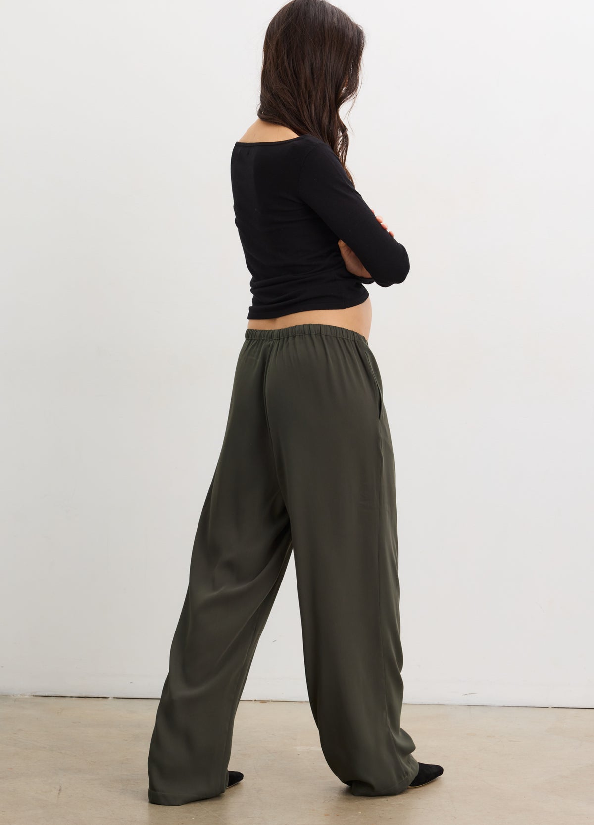 Maternity drapey pull-on pants in basil green with soft elastic waistband, loose fit for pregnant comfort.