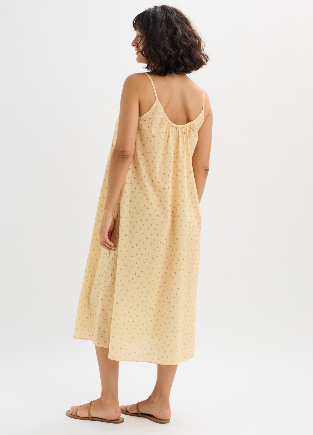 Light yellow cotton nursing nightgown with delicate floral pattern, midi length, and thin adjustable straps.
