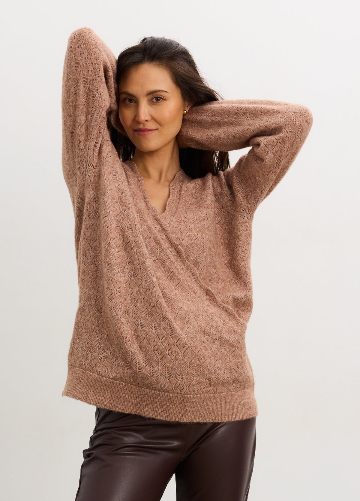 Mocha pointelle knit maternity sweater with V-neck and relaxed fit on pregnant model.
