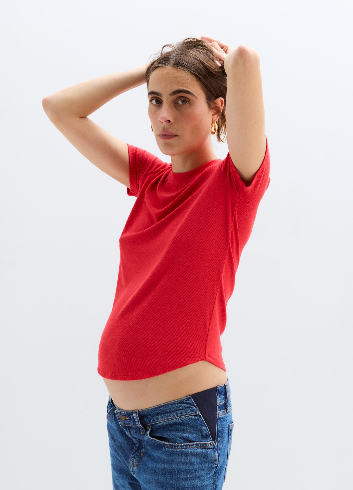 Red short-sleeve ribbed maternity tee with a fitted silhouette and stretch fabric.