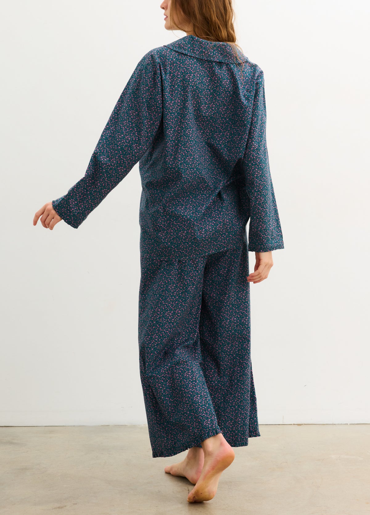 Dark blue maternity pajama pants with small floral print and relaxed straight-leg fit.