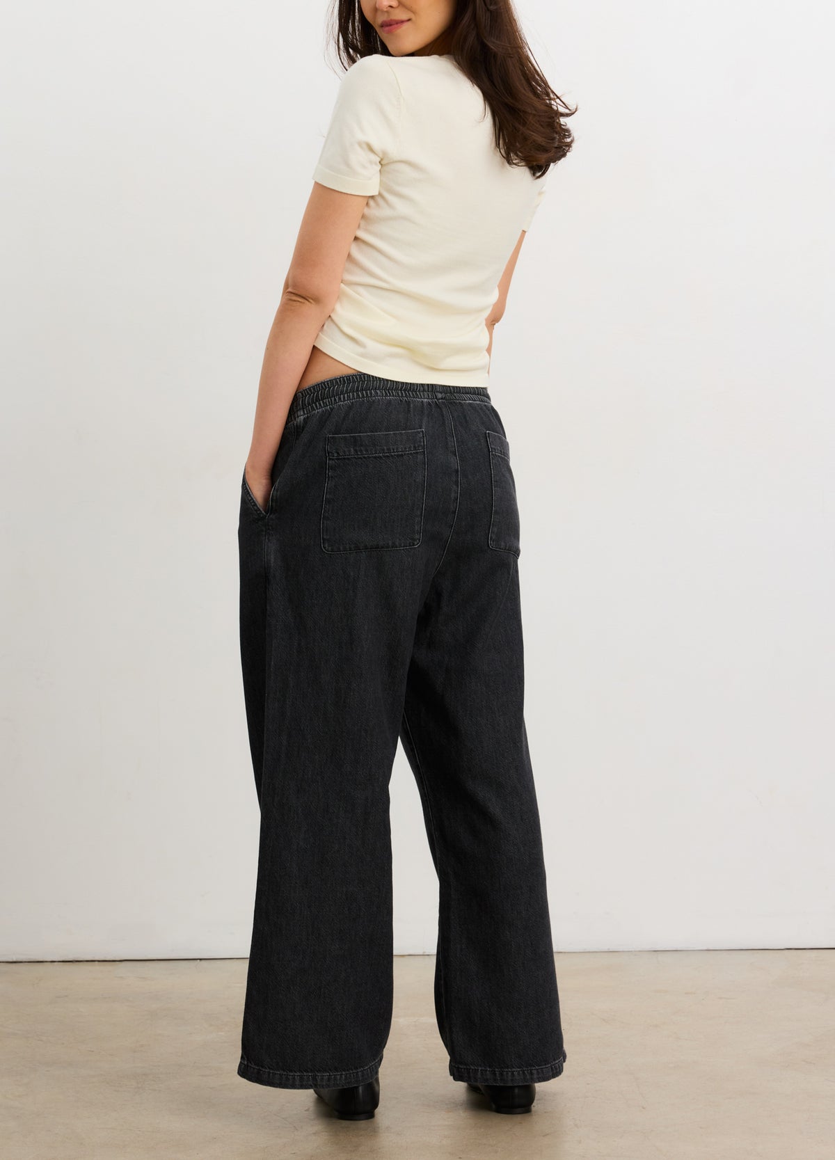 Dark indigo maternity wide-leg denim pants with a high, stretchy waistband and back pockets.