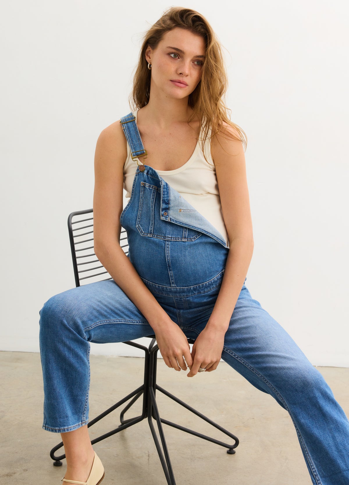 The Denim Maternity Overall - Indigo denim maternity overall with adjustable straps, side buttons, and roomy front panel for pregnancy, nursing, and.