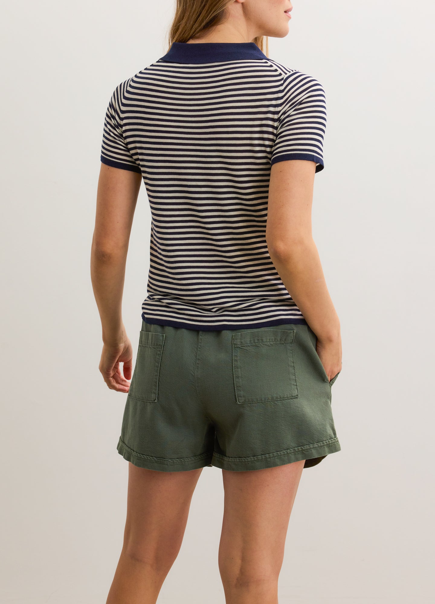 Olive green maternity denim shorts with a relaxed fit and soft fabric designed for pregnant comfort.