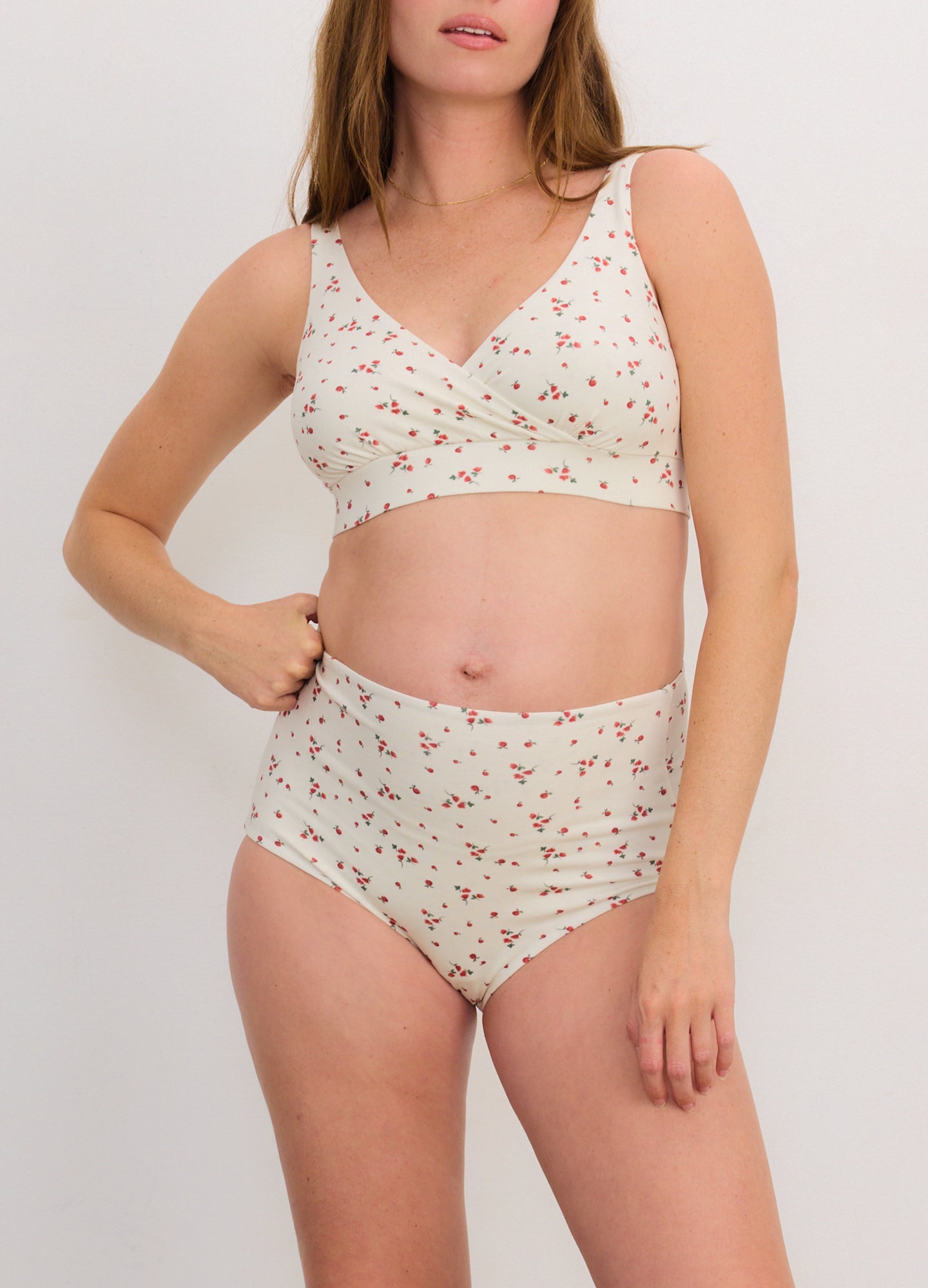 Cream nursing bra and high-waisted maternity briefs with small red floral print on soft fabric.