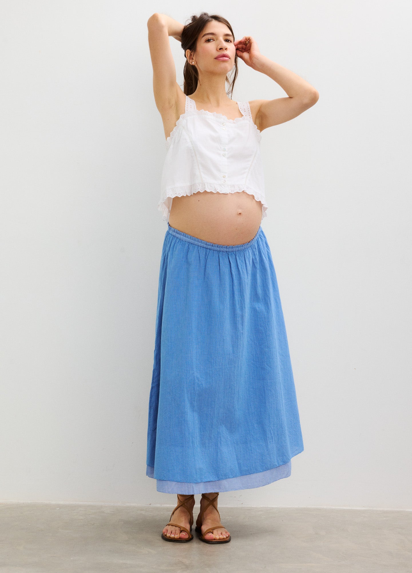 Light blue maternity skirt with elastic waistband, flowing maxi length, casual style.