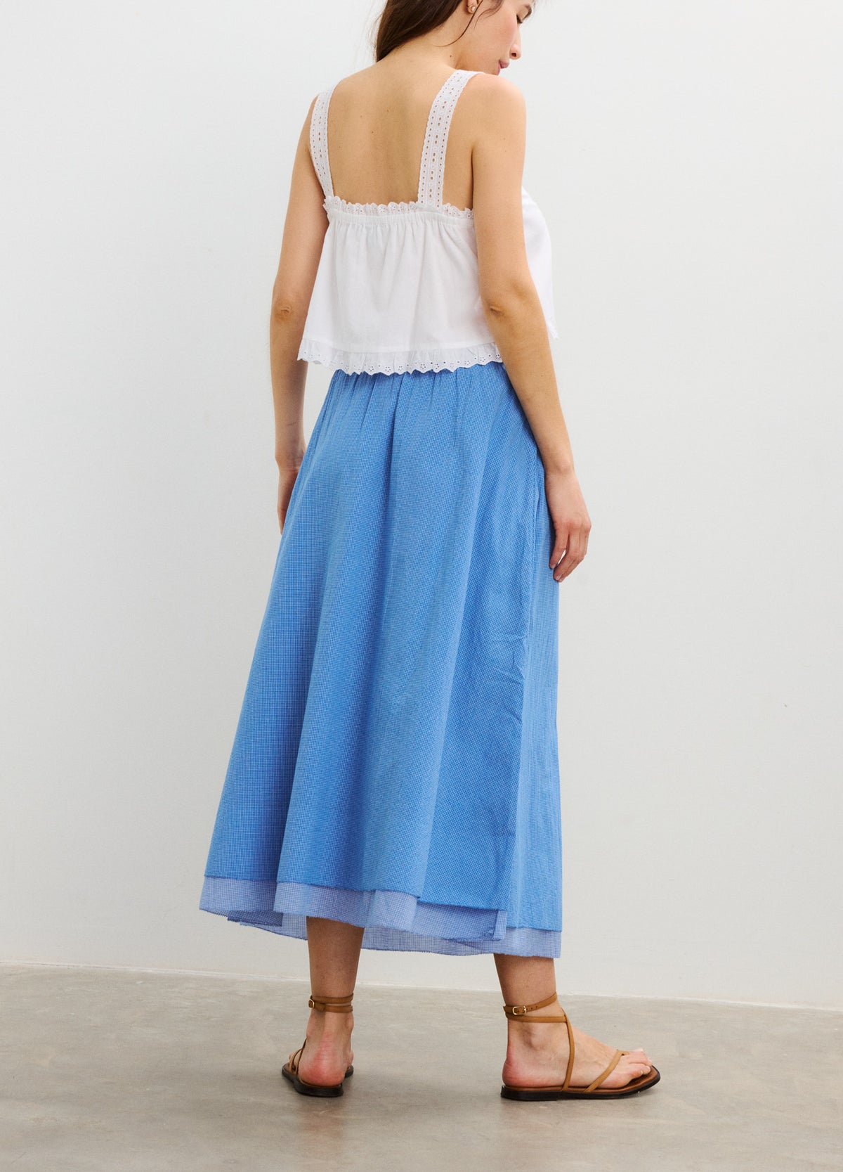 Light blue maternity midi skirt with a flowy, layered design and elastic waistband.