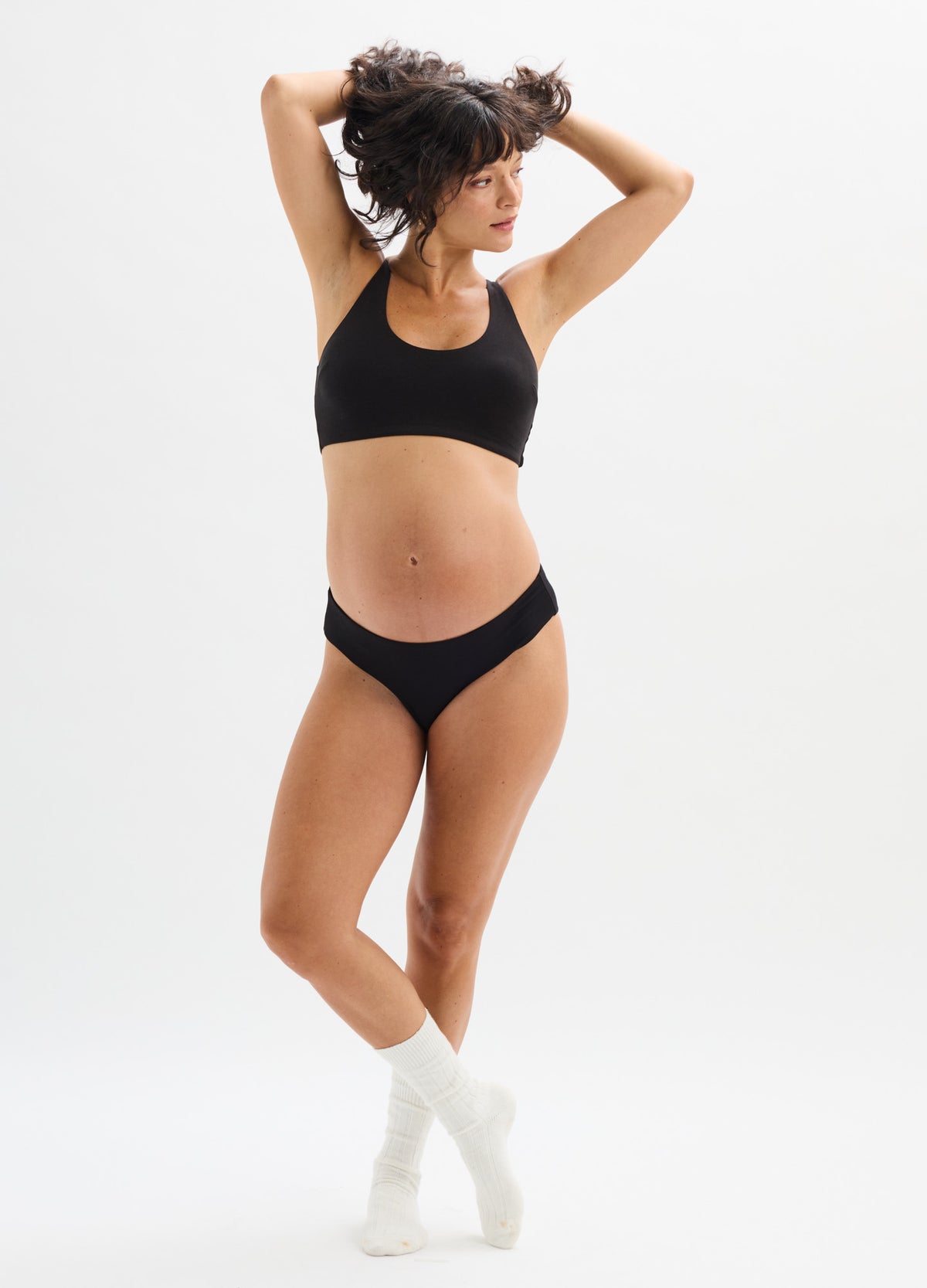 Black maternity brief with a low-rise waistband and soft, stretchy fabric designed for comfort during pregnancy.