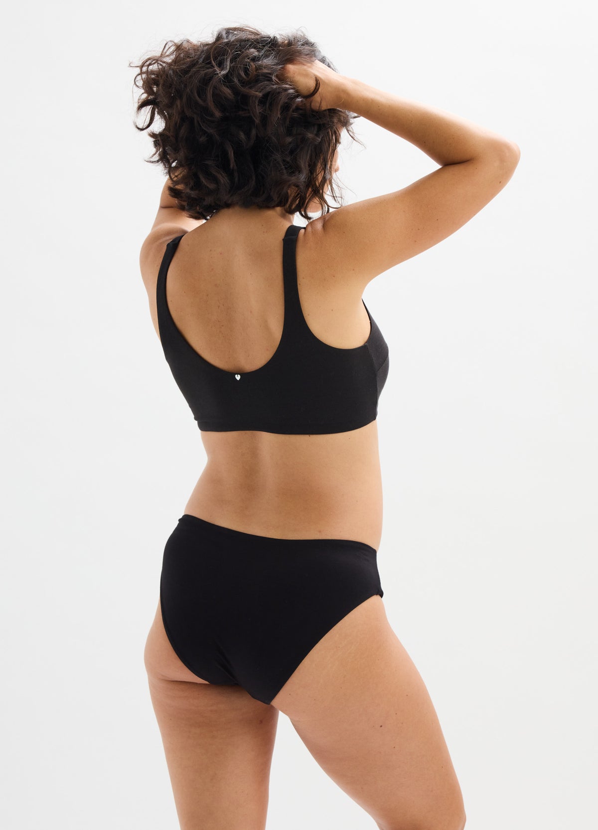 Black maternity briefs with full coverage, made from smooth, stretchy fabric for comfort during pregnancy.