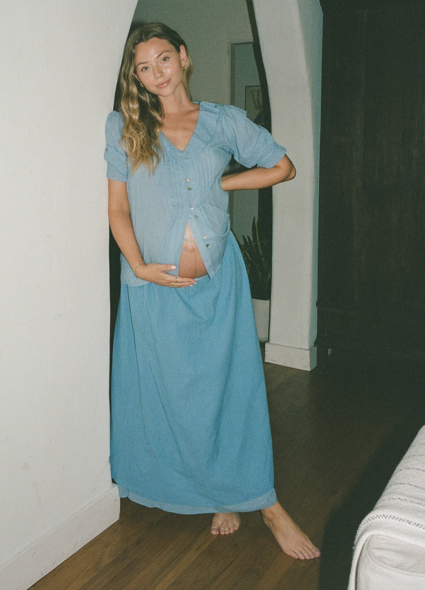 Light blue maternity maxi skirt with a soft, flowing fabric and a comfortable waistband designed for pregnant women.