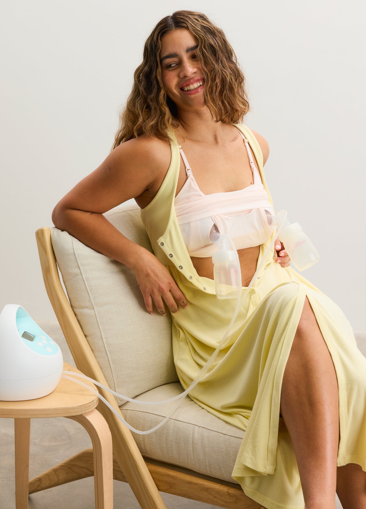 Soft yellow maternity nursing and pumping bra with adjustable straps paired with matching yellow robe, designed for comfort.