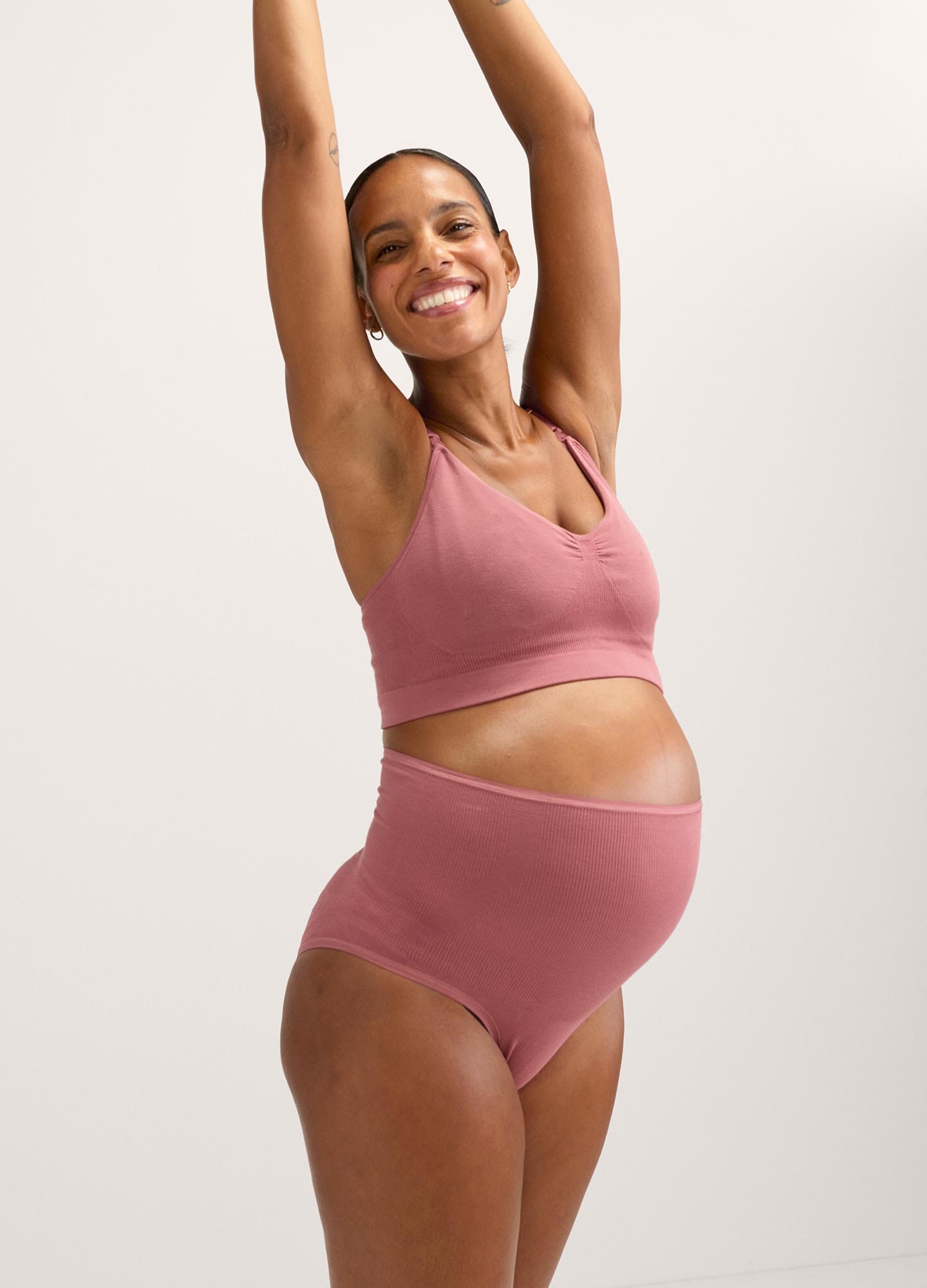 Mauve seamless maternity pumping bra with wide straps and supportive band.