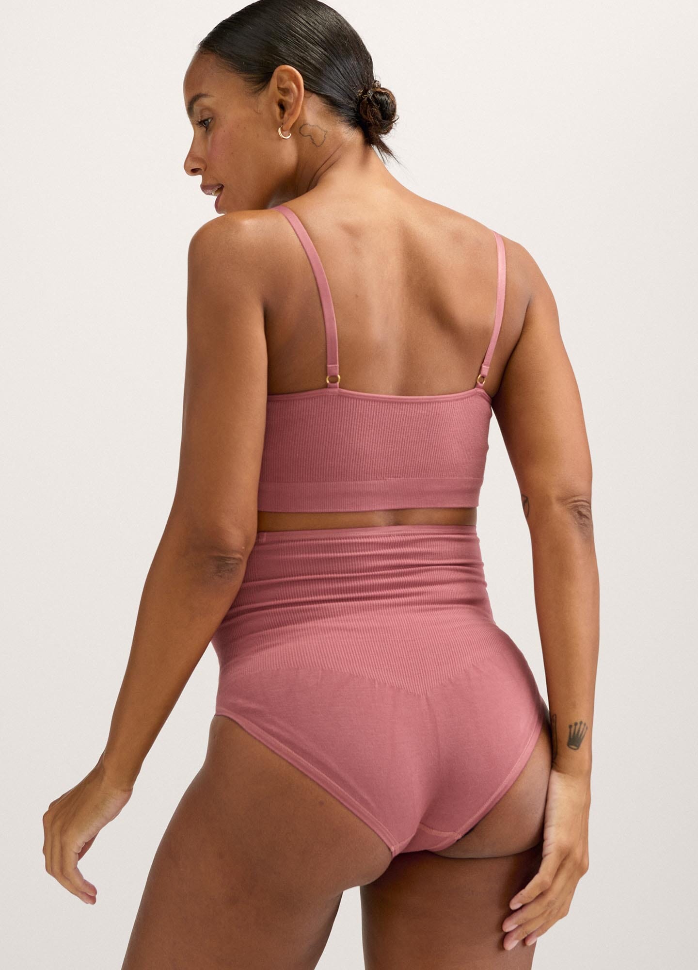 Mauve stretchy maternity pumping bra with adjustable thin straps and wide supportive band.