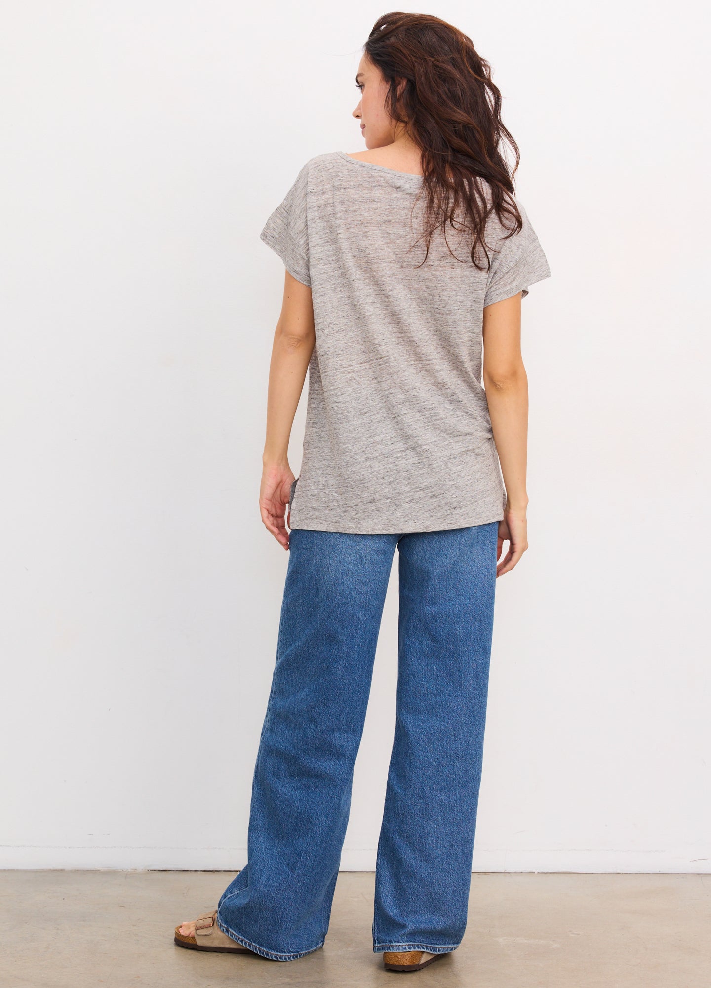 Grey striped linen short-sleeve maternity tee with relaxed fit and crew neckline.