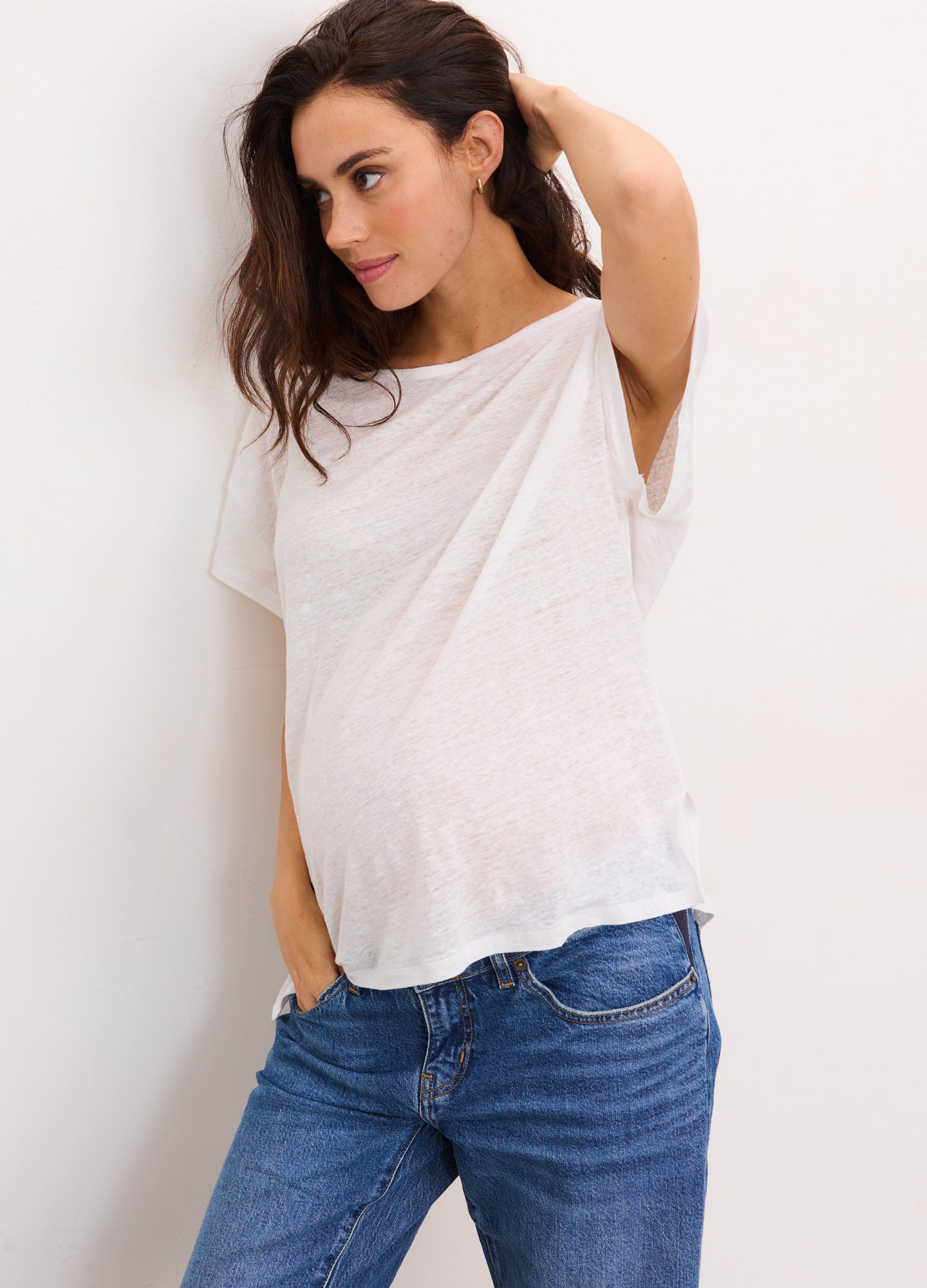 Light grey short sleeve linen tee with relaxed fit and scoop neckline, styled for maternity comfort.