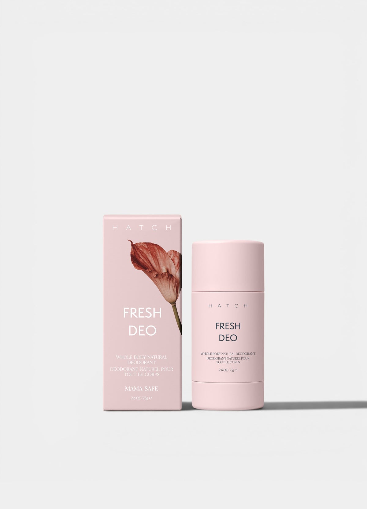 Light pink cylindrical deodorant stick with matching pink box featuring brown leaf design and "Fresh Deo" text.