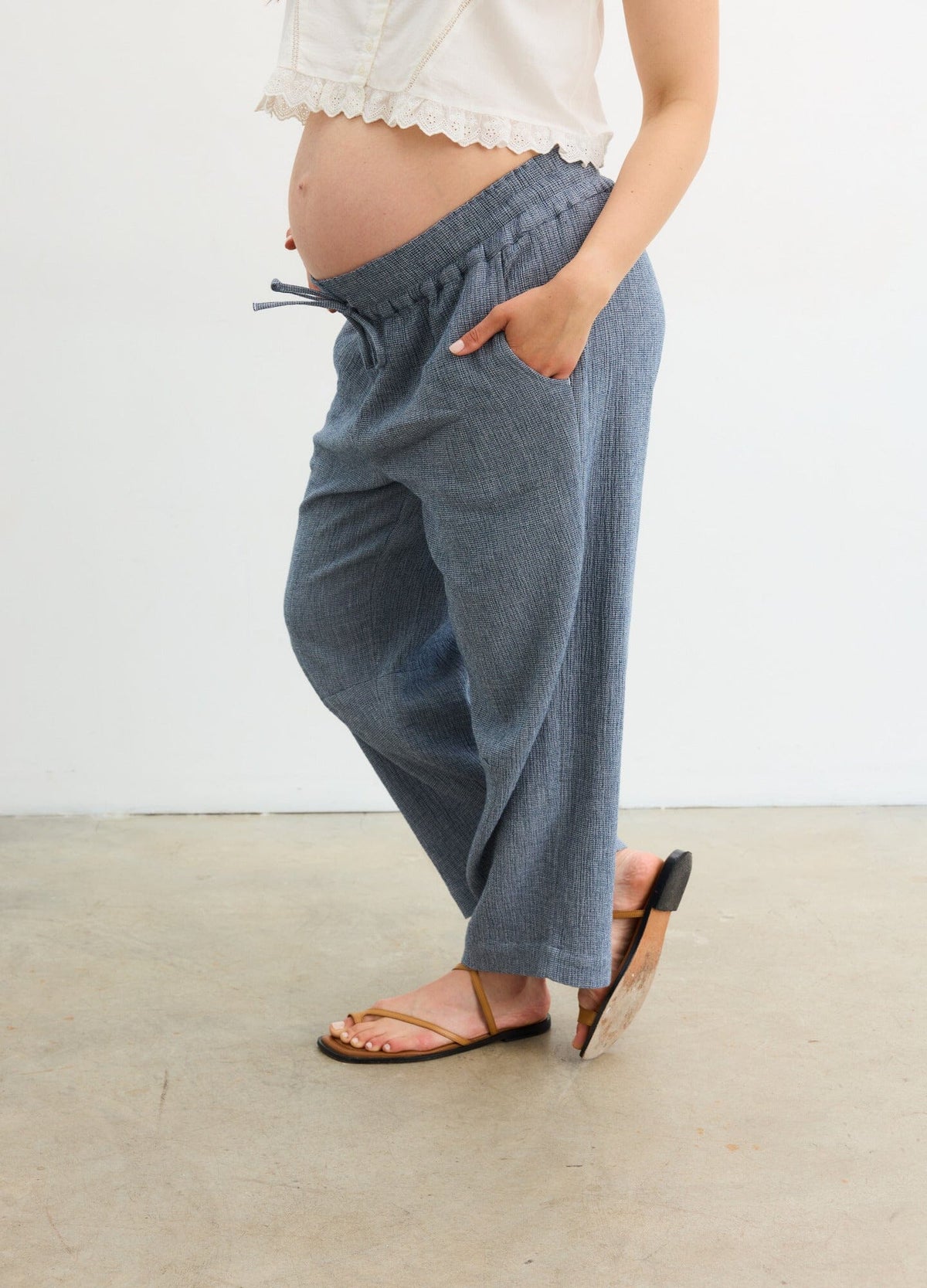 The Hayden Pant - Navy maternity pants with relaxed fit and elastic waistband, styled for pregnancy and postpartum comfort.