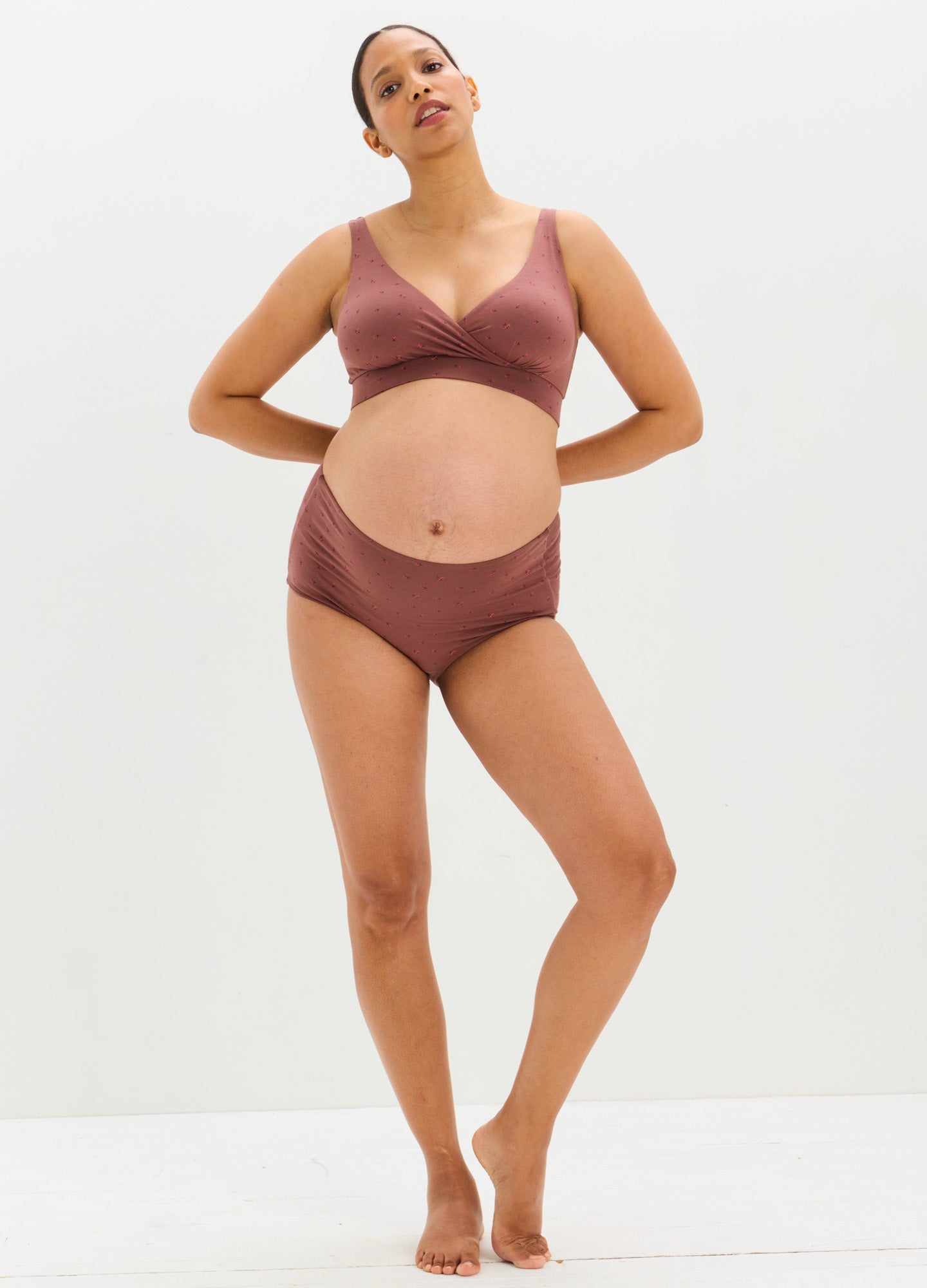 Mauve seamless maternity briefs with high tuck design on pregnant model.