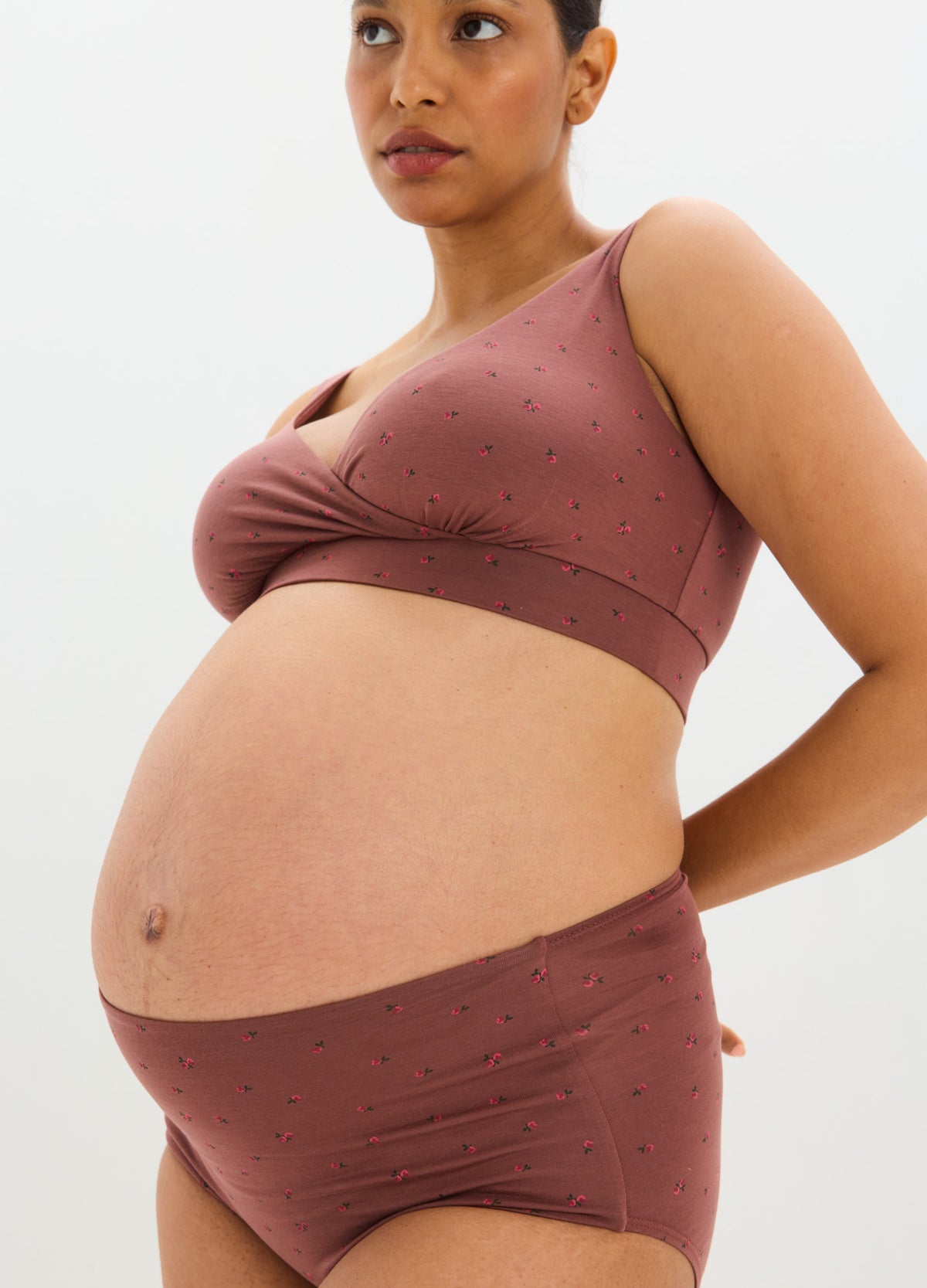Mauve seamless maternity briefs with high waistband and subtle dotted texture on pregnant model.