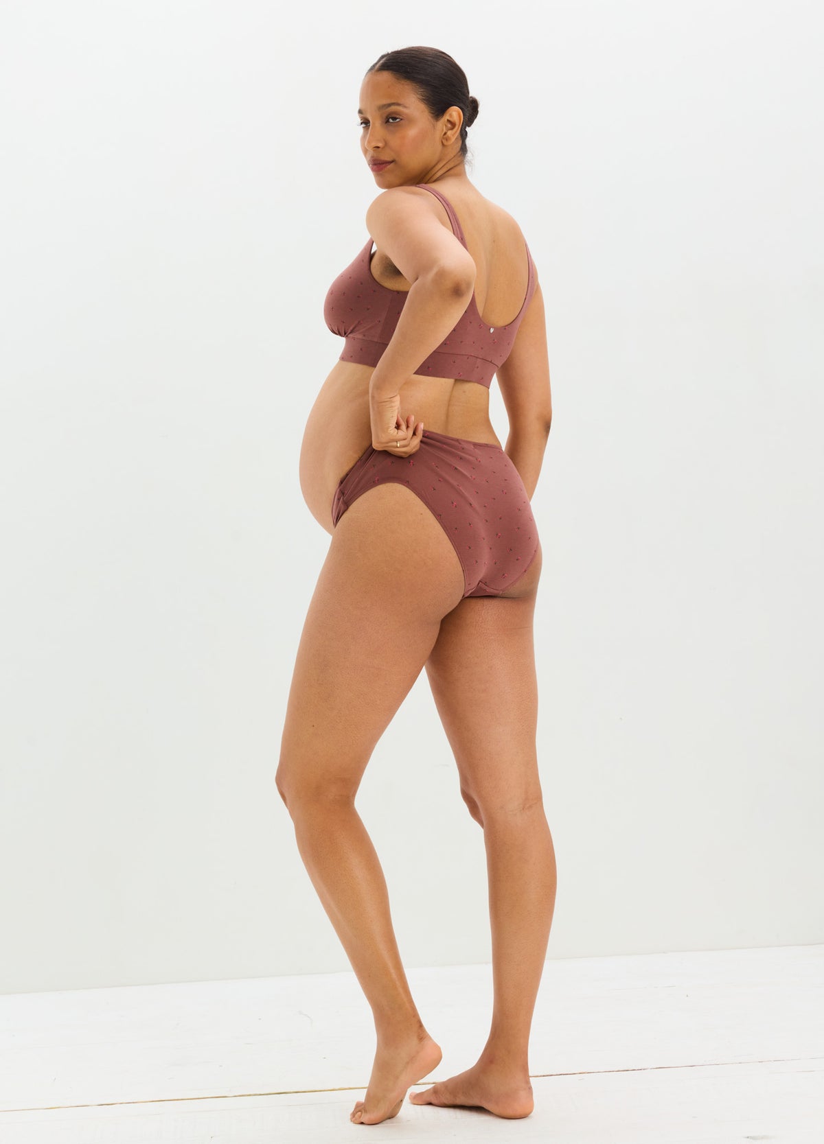 Mauve stretchy maternity briefs with high waist and supportive tummy panel, modeled from back.