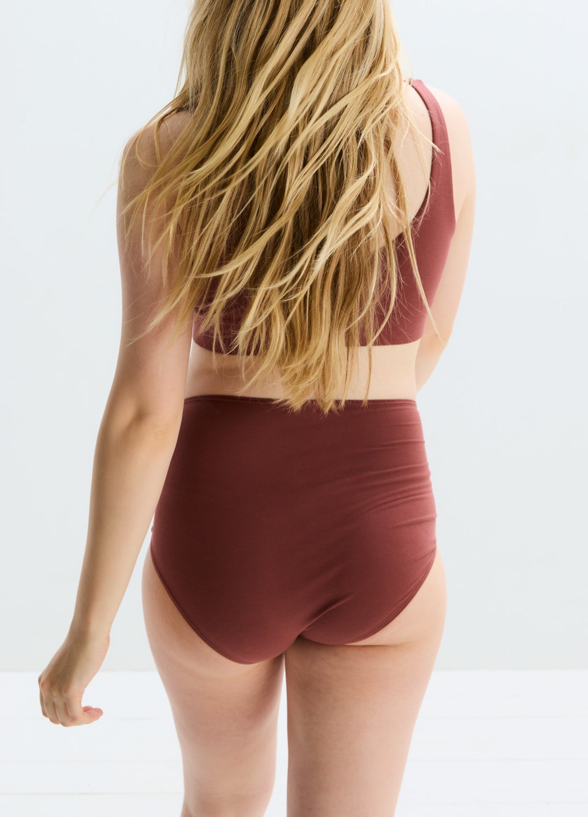 High-waisted maternity brief in deep brown with smooth, stretchy fabric and full back coverage.
