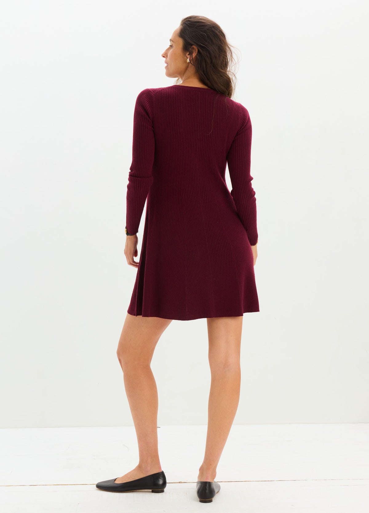 Burgundy long-sleeve knit mini dress with a relaxed fit and crew neckline, designed for maternity and nursing.